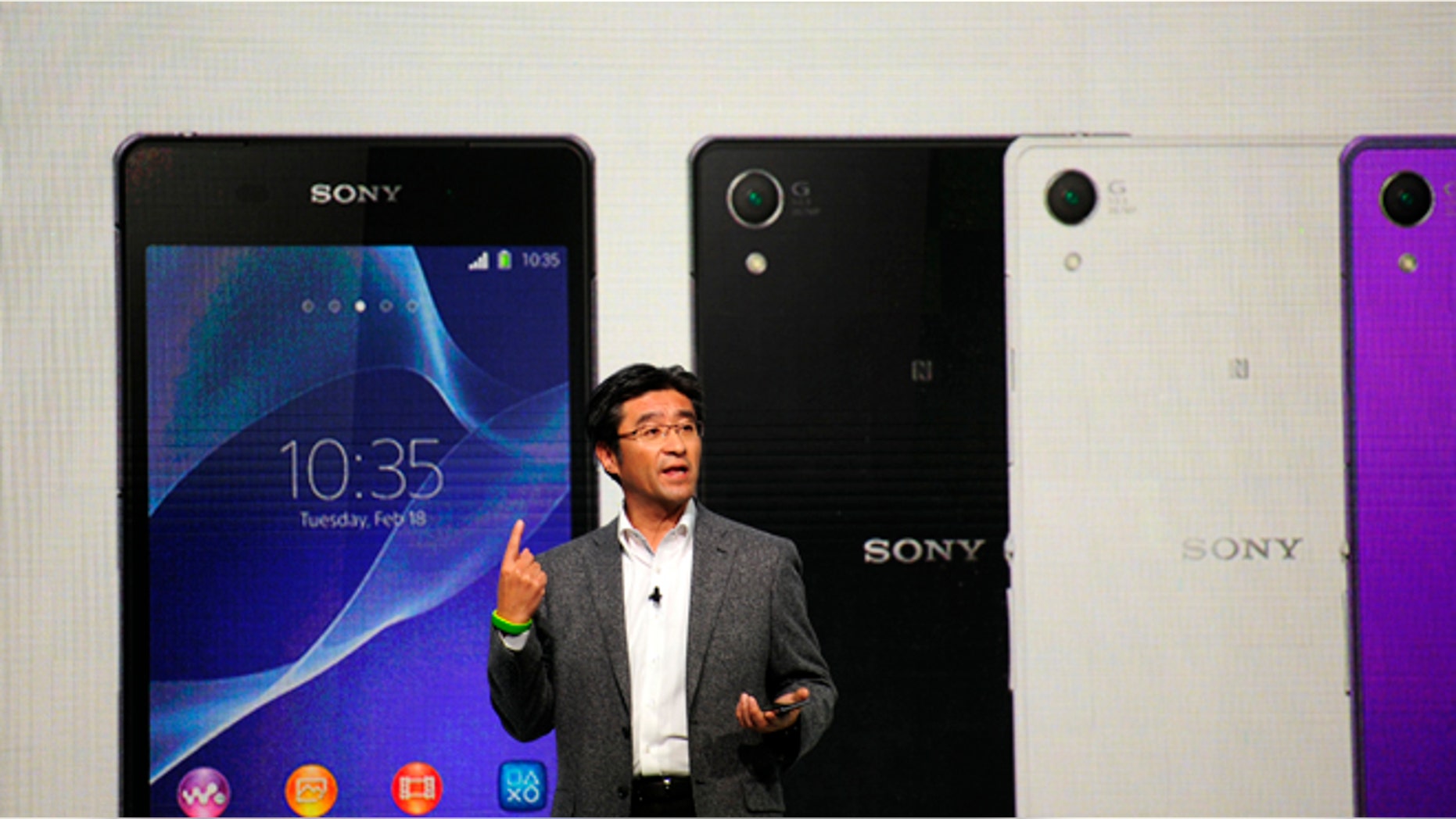 President and CEO of Sony Mobile Communications Kunimasa Suzuki presents the Smartphone Xperia Z2 during the Mobile World Congress, the world's largest mobile phone trade show in Barcelona, Spain, Monday, Feb. 24, 2014.