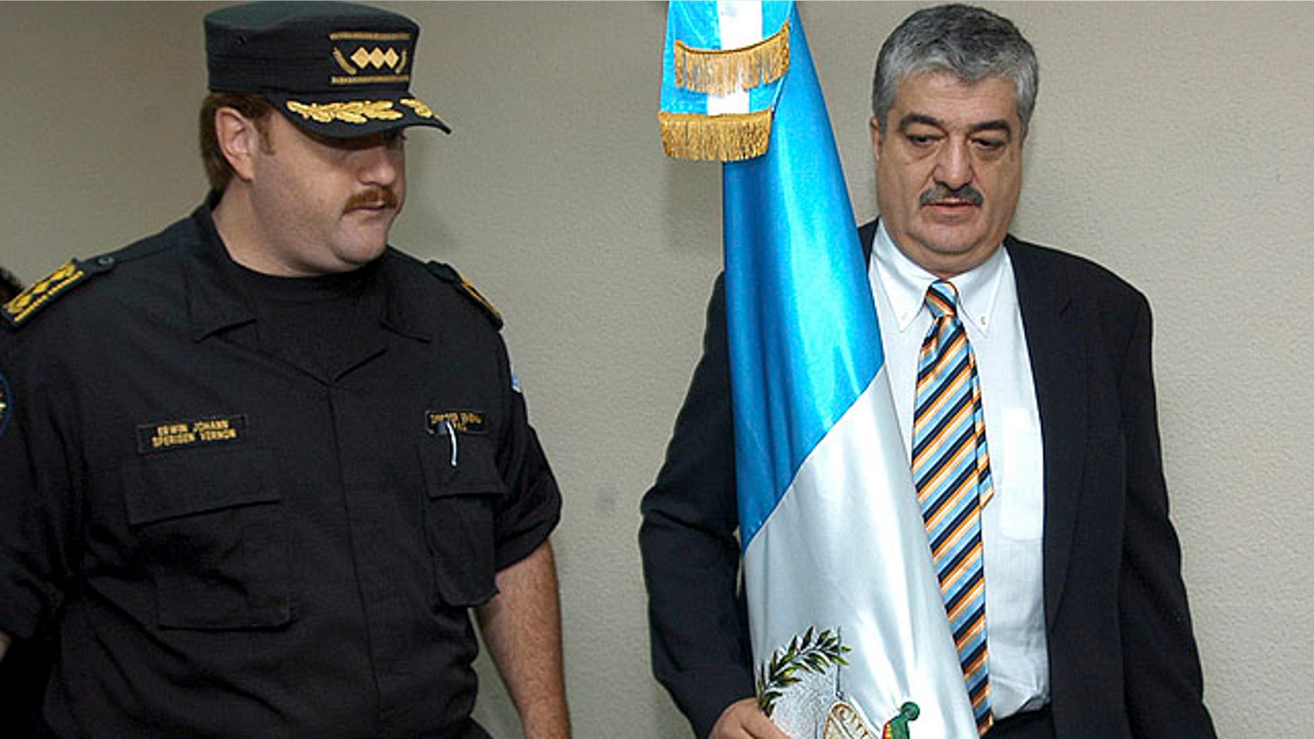 Photo taken on November 12, 2005 showing the then Interior Minister of Guatemala Carlos Vielman, right, with Guatemala Chief of Police Edwin Sperinsen. Spanish police say they have arrested former Guatemalan Interior Minister Carlos Vielman wanted in connection with the alleged killing of seven prisoners in 2006.