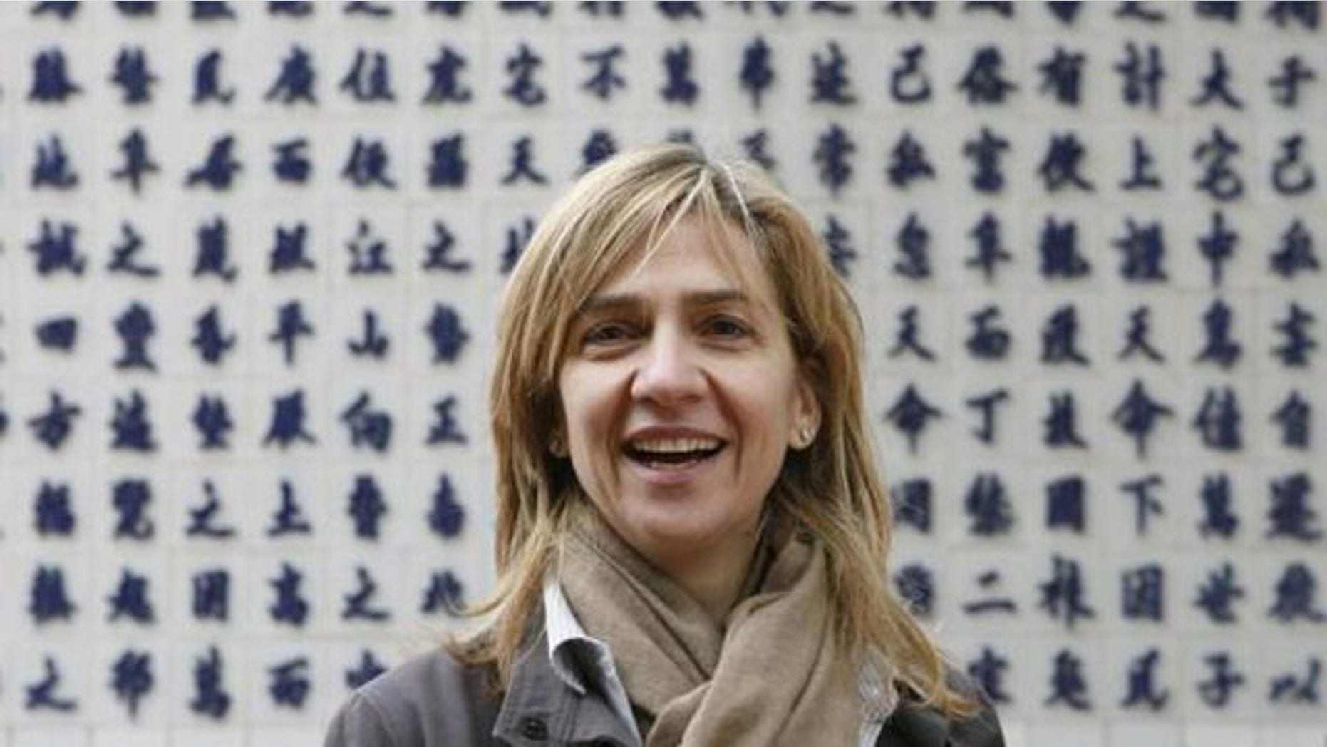 Spain's Princess Infanta Cristina smiles during a visit to a temple in Vietnam in 2009 (Reuters)