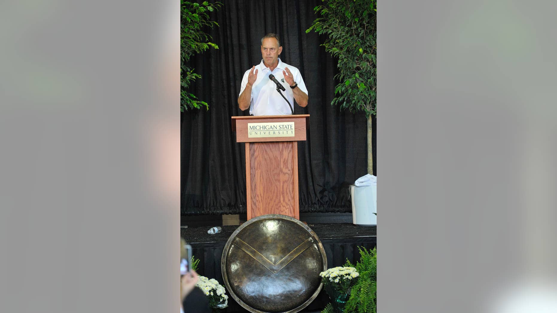 In this photo taken on Monday, Aug. 25, 2014, Michigan State head football coach Mark Dantonio speaks during a ceremony as the university unveils their north end zone addition to Spartan Stadium in East Lansing, Mich. (AP Photo/Detroit News, Dale G. Young) DETROIT FREE PRESS OUT; HUFFINGTON POST OUT