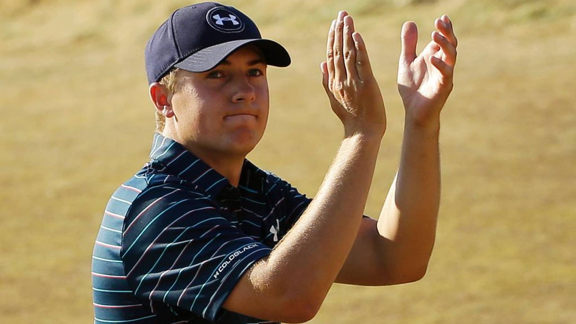 FILE - In this June 21, 2015, file photo, Jordan Spieth claps after finishing the final round of the U.S. Open golf tournament at Chambers Bay in University Place, Wash. Spieth isn't taking the traditional route to the British Open. Rather than prep for St. Andrews in Scotland this weekend, Speith will spend it in the Quad Cities playing the John Deere Classic _ site of his first win as a pro two years ago. (AP Photo/Ted S. Warren, File)