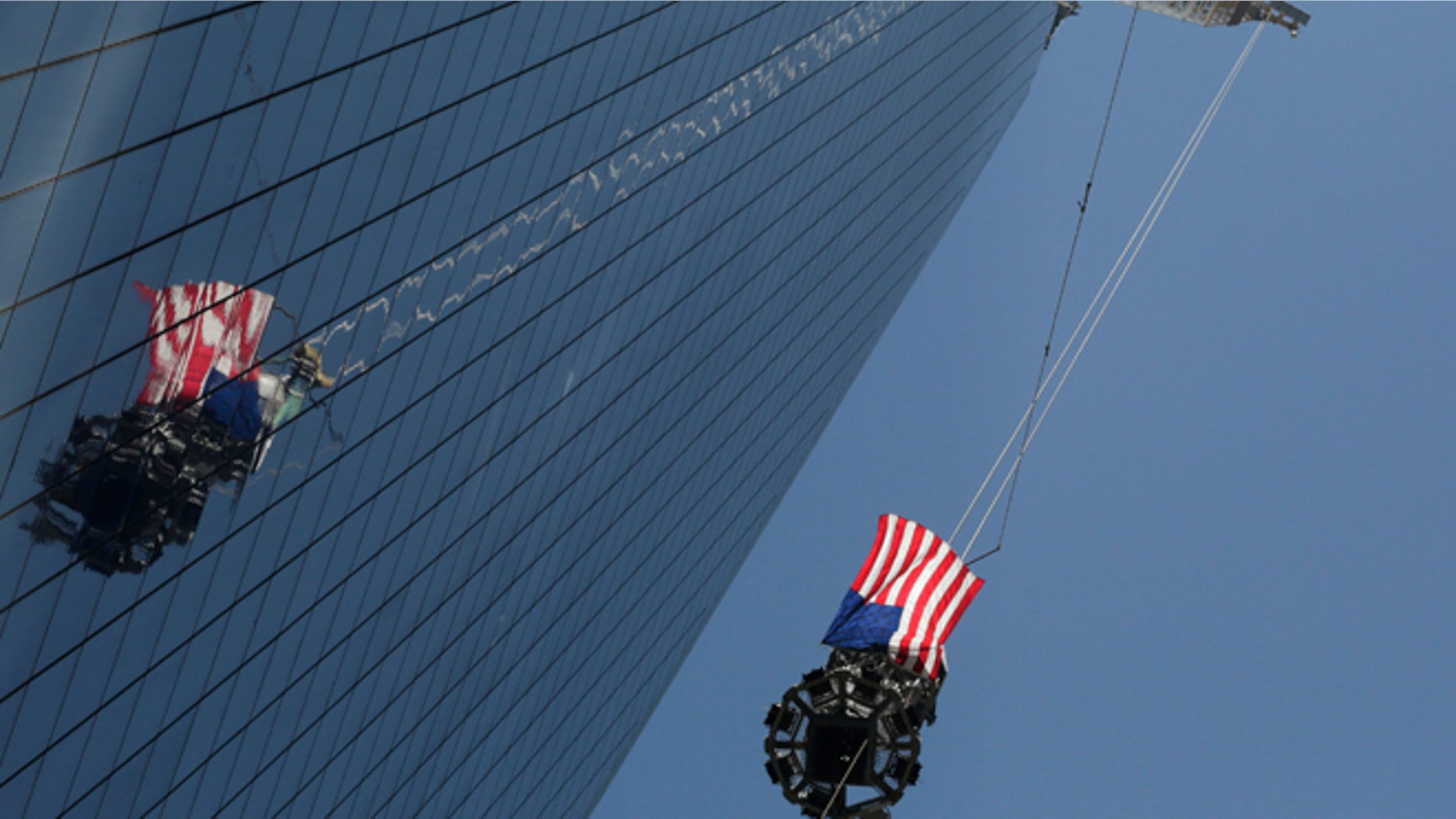 May 2: The final piece of spire is hoisted to the roof of One World Trade Center, in New York.
