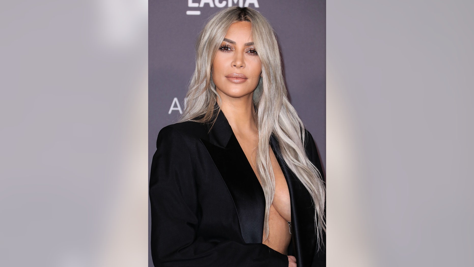 Kim Kardashian sparked outrage online by posting a topless photo taken by her four-year-old daughter.
