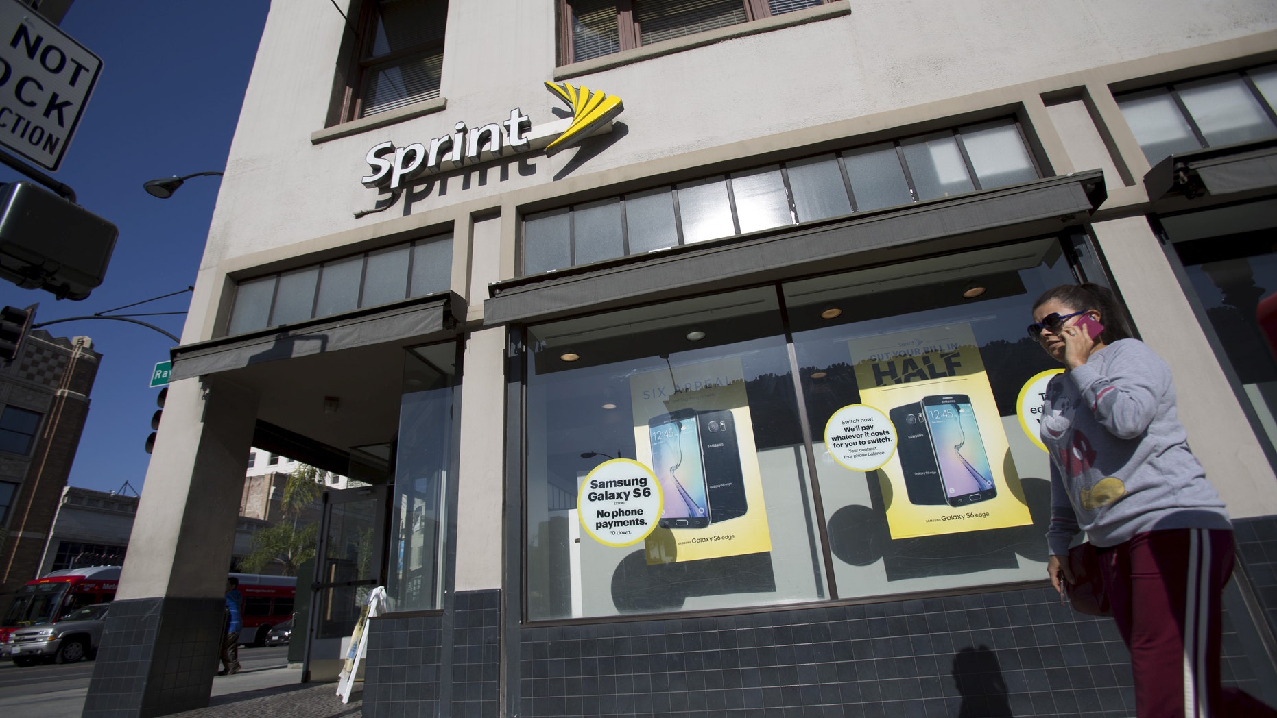 File photo - A person walks by a Sprint store in Pasadena, California May 4, 2015.