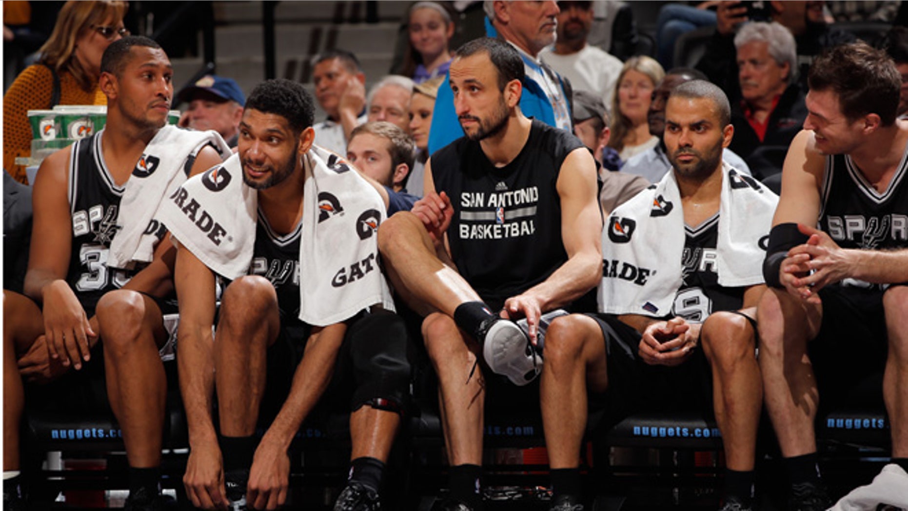 DENVER, CO - JANUARY 20: (L-R) Boris Diaw #33, Tim Duncan #21, Manu Ginobili #20, Tony Parker #9 and Tiago Splitter #22 of the San Antonio Spurs sit on the bench late in the game against the Denver Nuggets at Pepsi Center on January 20, 2015 in Denver, Colorado. The Spurs defeated the Nuggets 109-99. NOTE TO USER: User expressly acknowledges and agrees that, by downloading and or using this photograph, User is consenting to the terms and conditions of the Getty Images License Agreement. (Photo by Doug Pensinger/Getty Images)