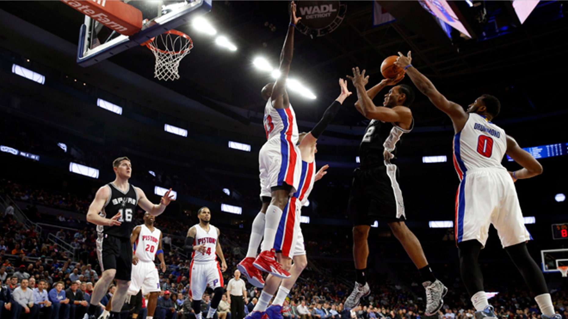 San Antonio Spurs forward Kawhi Leonard (2) shoots against the Detroit Pistons in the first half of an NBA basketball game in Auburn Hills, Mich., Wednesday, Feb. 11, 2015. (AP Photo/Paul Sancya)