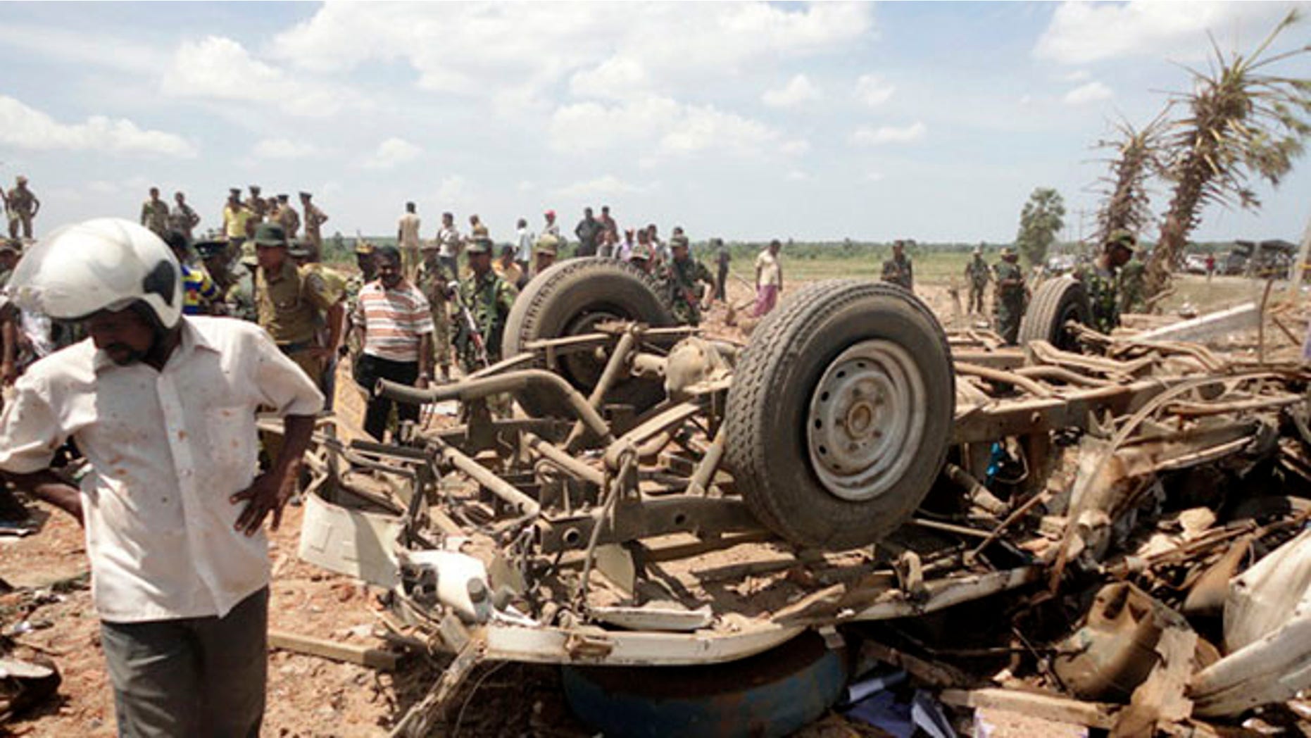 September 17: Sri Lankan police officers inspect the site of an explosion at a police station in Karadiyanaru, a small town in the former conflict zone in eastern Sri Lanka. (AP)