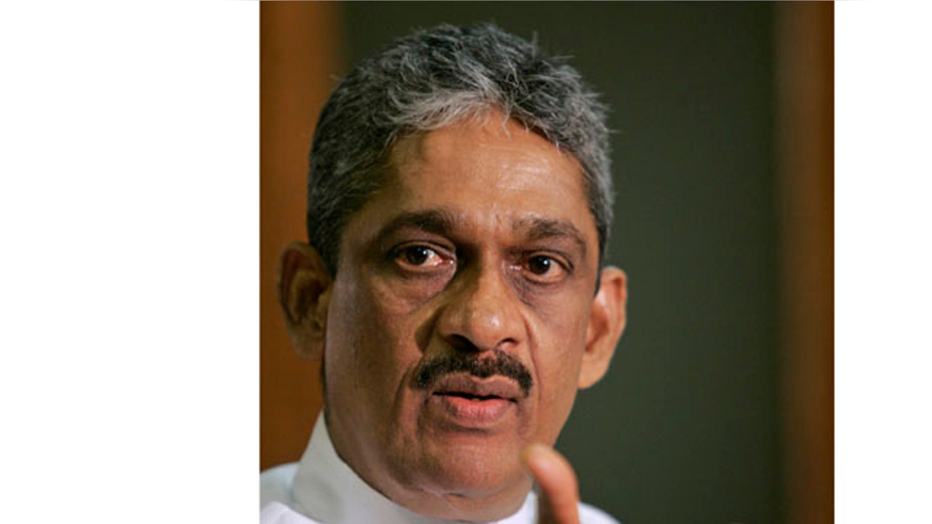 In this Sept. 8, 2010 file photo, Sri Lankan lawmaker and former military chief Sarath Fonseka addresses the media in Colombo, Sri Lanka.