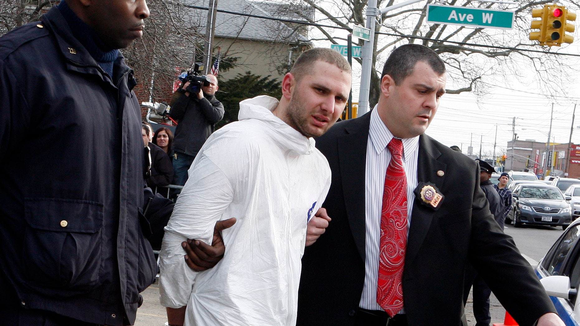 Feb. 13: Maksim Gelman of Brooklyn, center, who is accused of going on a 28-hour stabbing rampage through New York City, is lead by officers in Brooklyn, N.Y. Authorities said in a court document released March 15 that Gelman told police he had cancer, lamented his family life, said he wished police had shot him, and declared he had experienced 'a doozy of a day.'