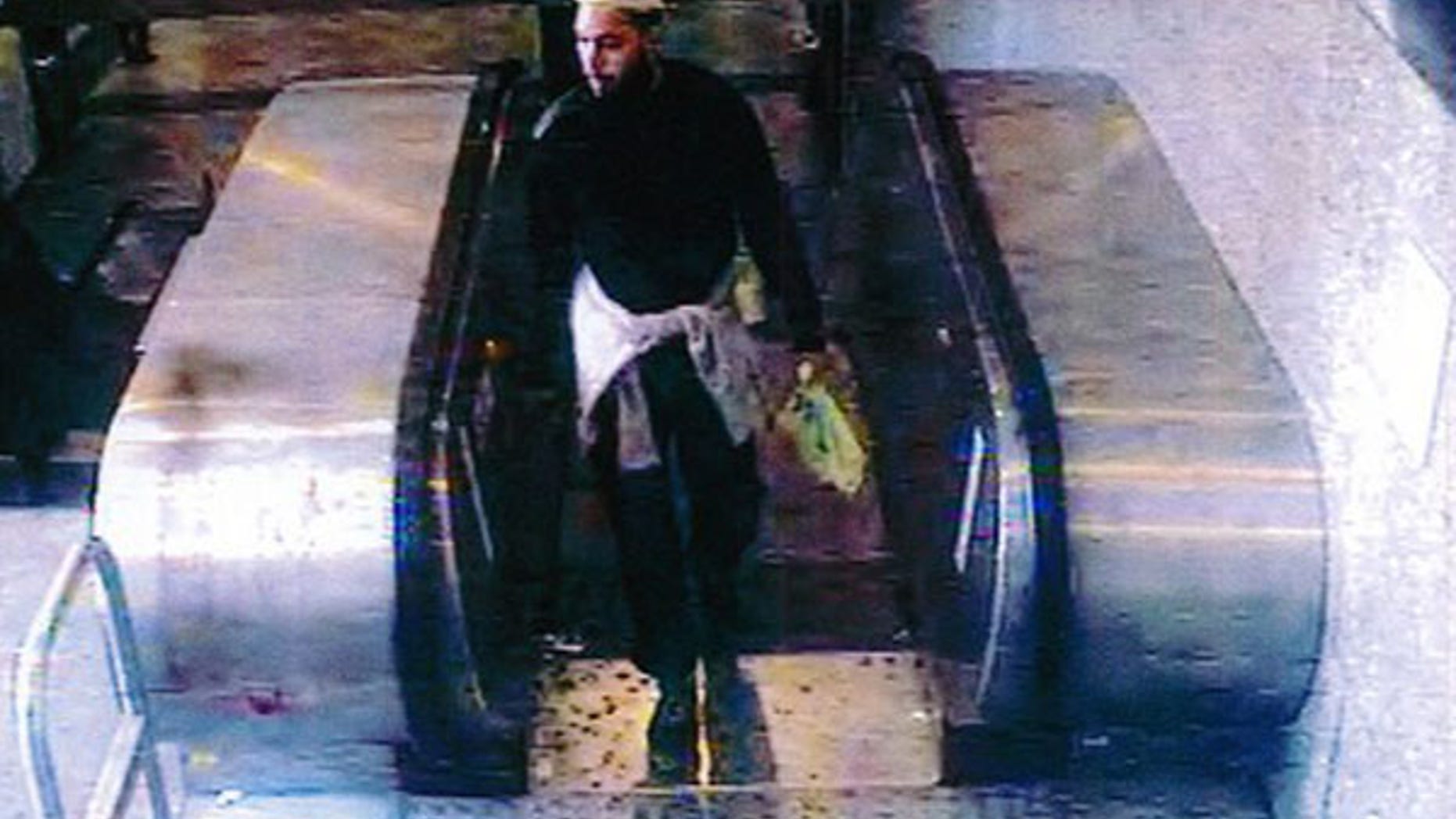 This still image taken from footage taken from a security camera May 25, 2013, and provided by French private TV station M6 on May 29, 2013, shows the 22-year-old French suspect, identified only by his first name Alexandre, as he was strolling in a mall before stabbing a French soldier who was patrolling at the La Defense financial and shopping district, north of Paris, France.