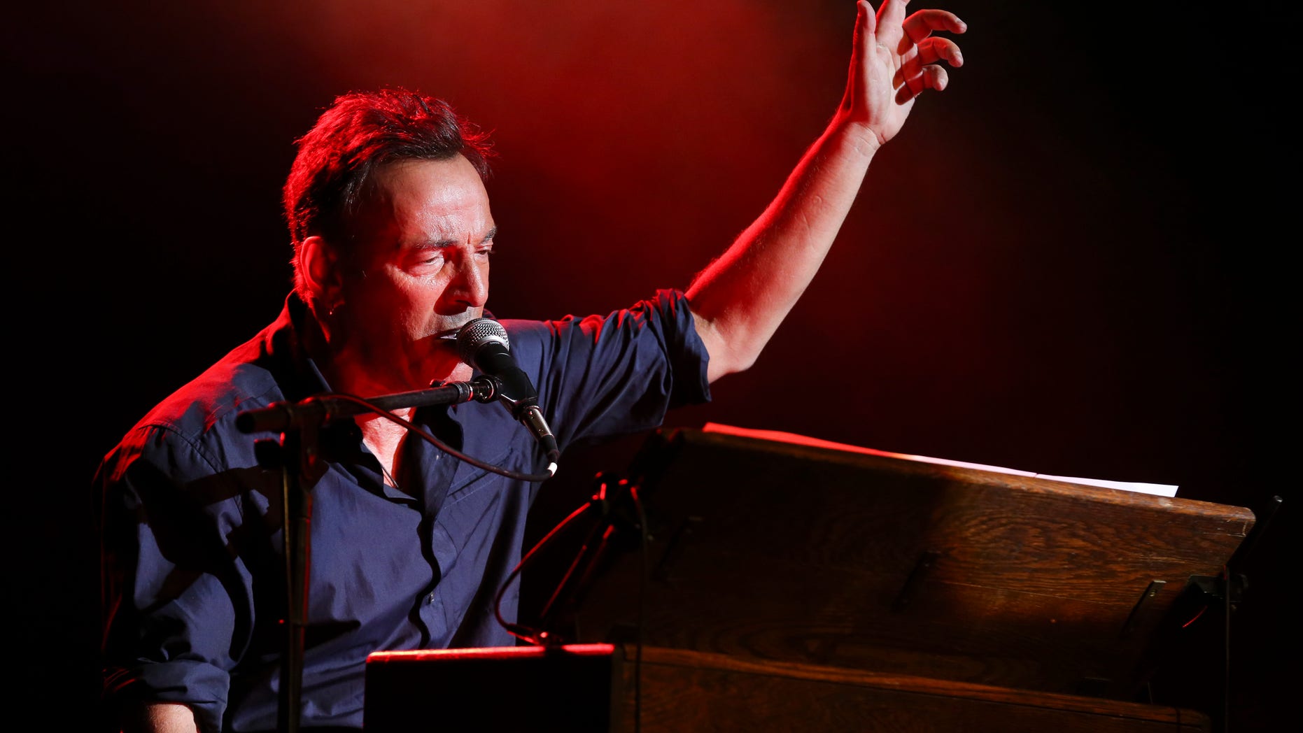Musician Bruce Springsteen performs at the Stand Up for Heroes event at Madison Square Garden, Wednesday, Nov. 6, 2013, in New York. (John Minchillo/Invision/AP)