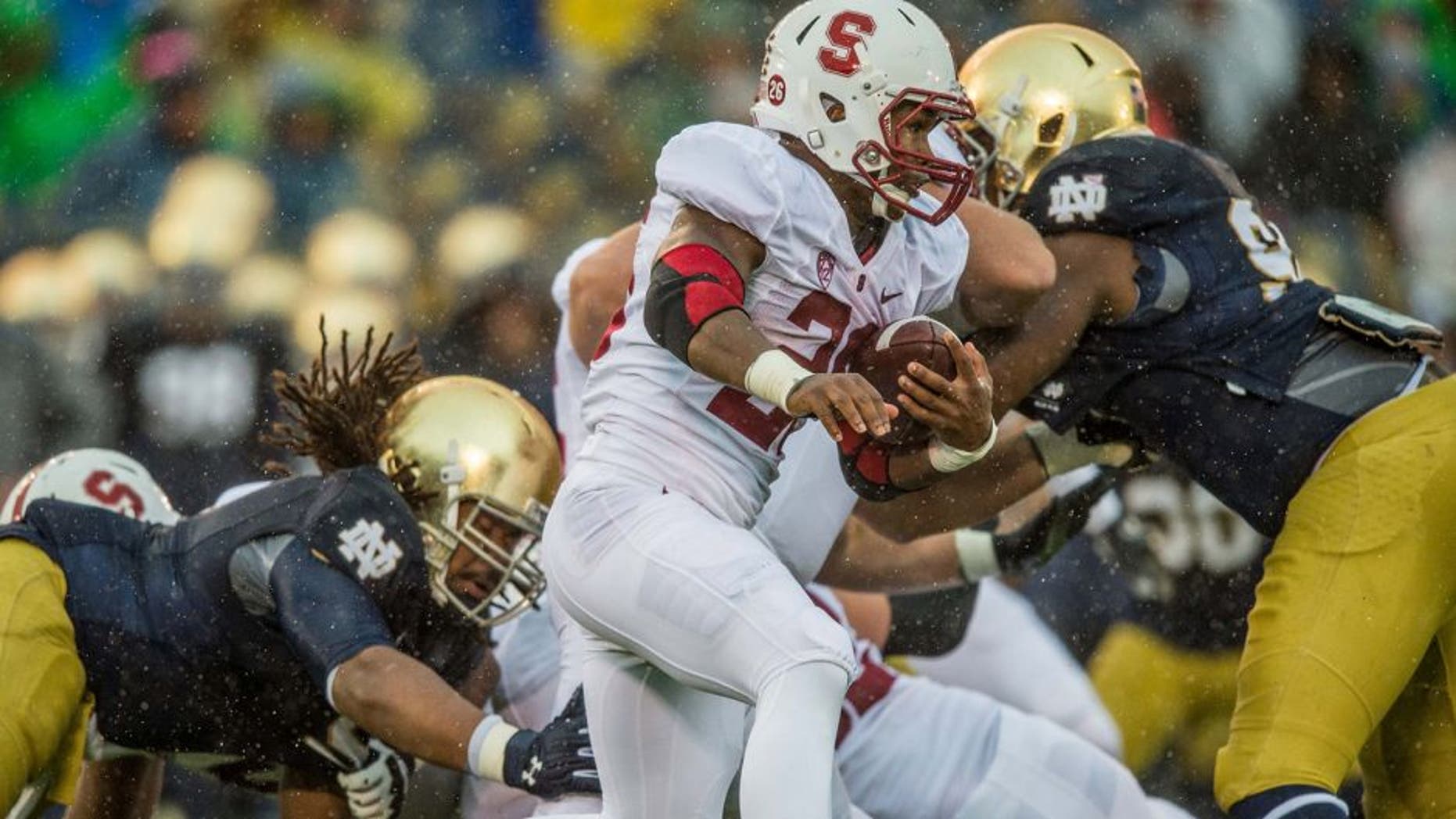 Oct 4, 2014; South Bend, IN, USA; Stanford Cardinal running back Barry Sanders (26) carries the ball in the second quarter against the Notre Dame Fighting Irish at Notre Dame Stadium. Mandatory Credit: Matt Cashore-USA TODAY Sports