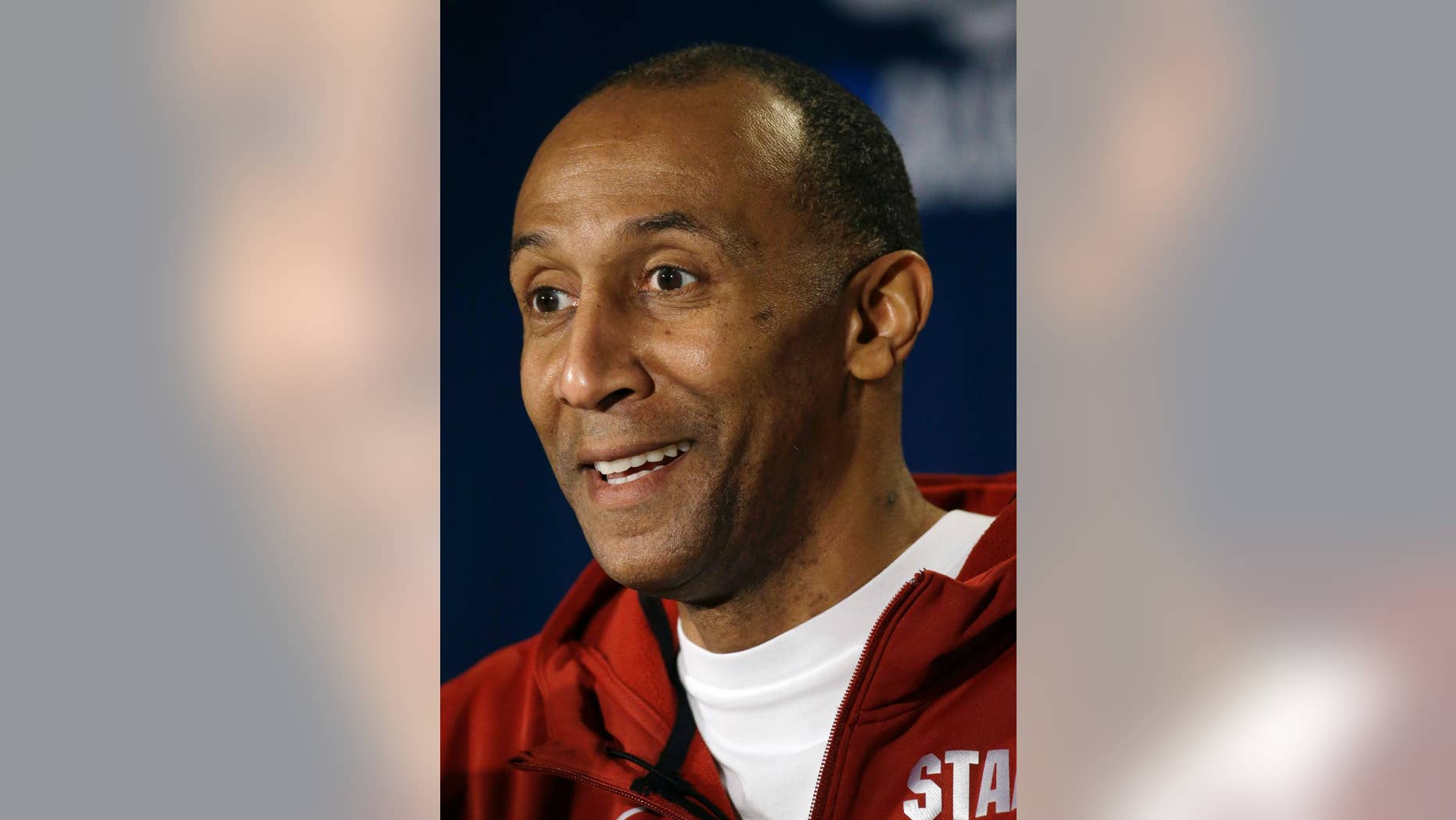 FILE - This March 22, 2014, file photo shows Stanford head coach Johnny Dawkins speaking during a news conference at the NCAA college basketball tournament in St. Louis. Dawkins has been rewarded for his impressive NCAA tournament run last season and overall strides as Stanford coach, receiving a contract extension Wednesday, Sept. 24, 2014. (AP Photo/Jeff Roberson, File)