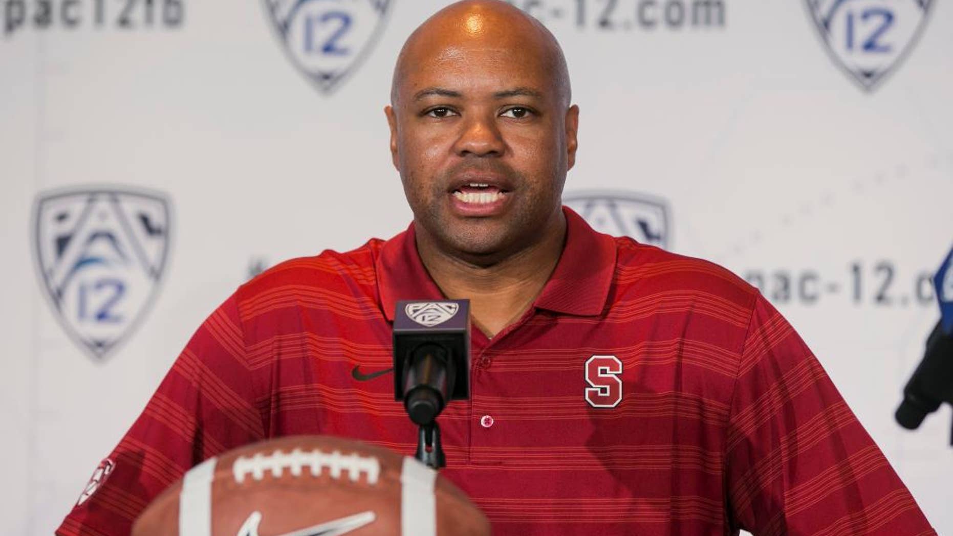FILE - In this July 24, 2014, file photo, Stanford head coach David Shaw takes questions at the 2014 Pac-12 NCAA college football media days in Los Angeles. Nobody might have been happier when the Pac-12’s preseason media poll picked Oregon to win the North Division than Stanford coach Shaw and his players. (AP Photo/Damian Dovarganes, File)