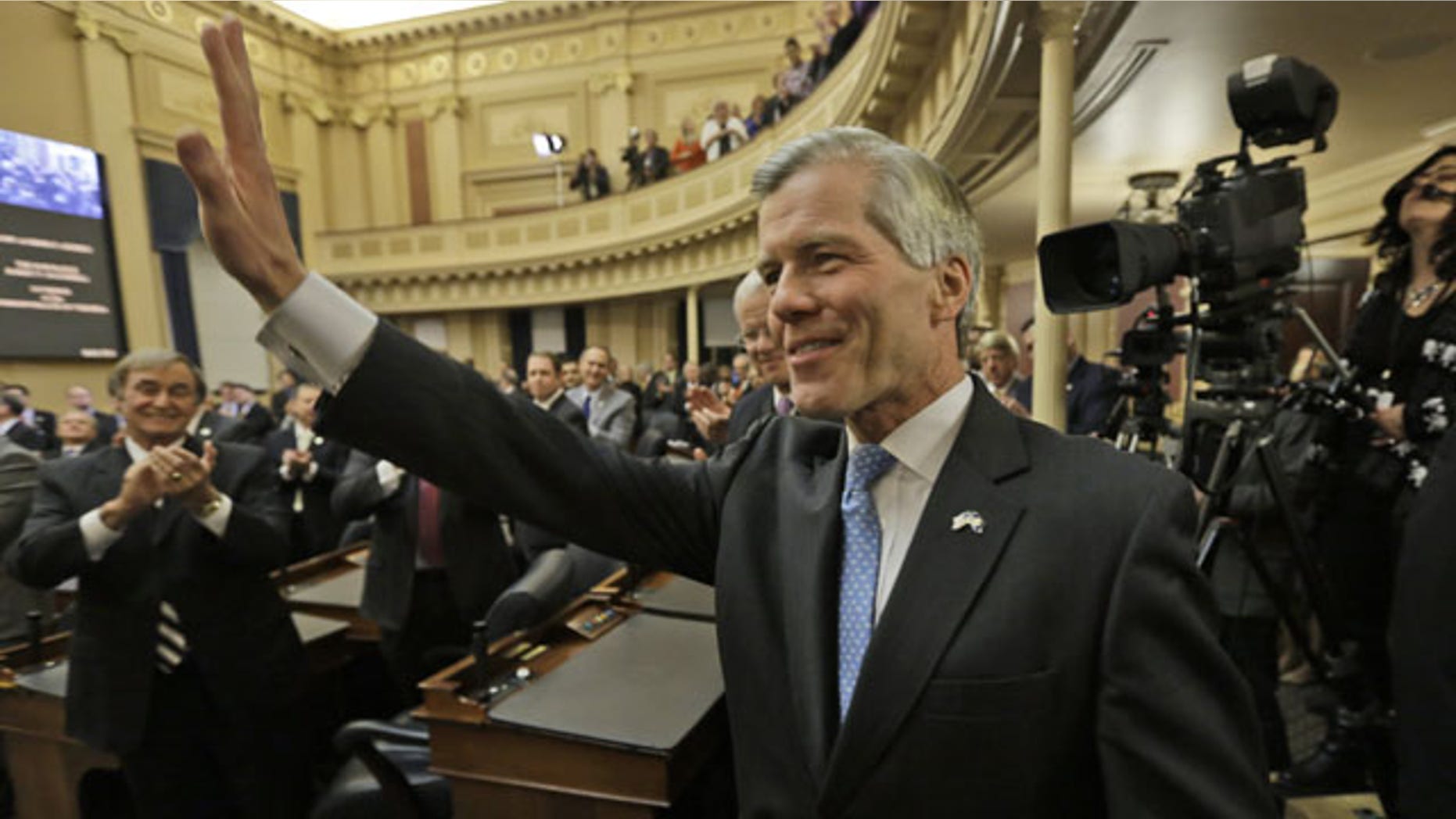 January 8, 2014: Virginia Gov. Bob McDonnell waves to the crowd after delivering his final State of the Commonwealth address before a joint session of the 2014 General Assembly at the Capitol in Richmond. McDonnell leaves office on Saturday. (AP Photo/Steve Helber)
