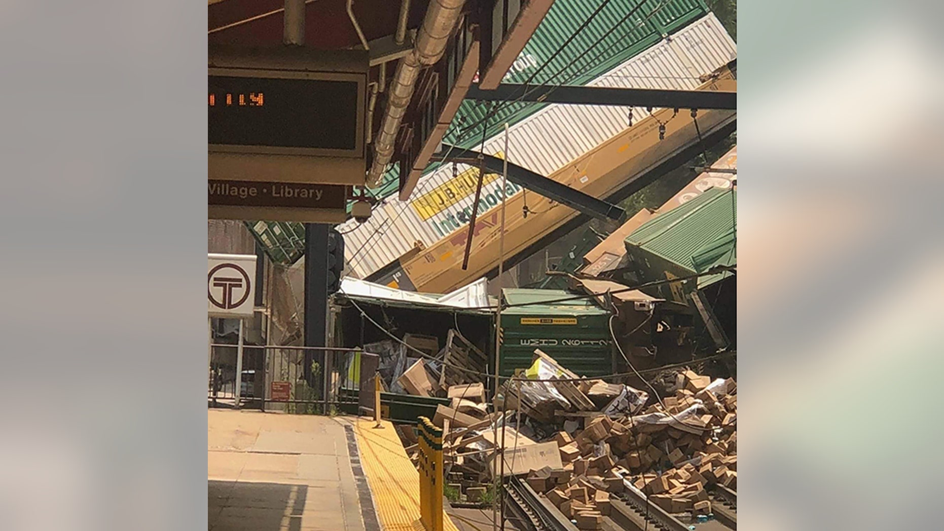 Seven rail cars from a freight train derailed in Pittsburgh, sending shipping containers tumbling down a hillside onto light rail tracks below, but no injuries have been reported, authorities said.