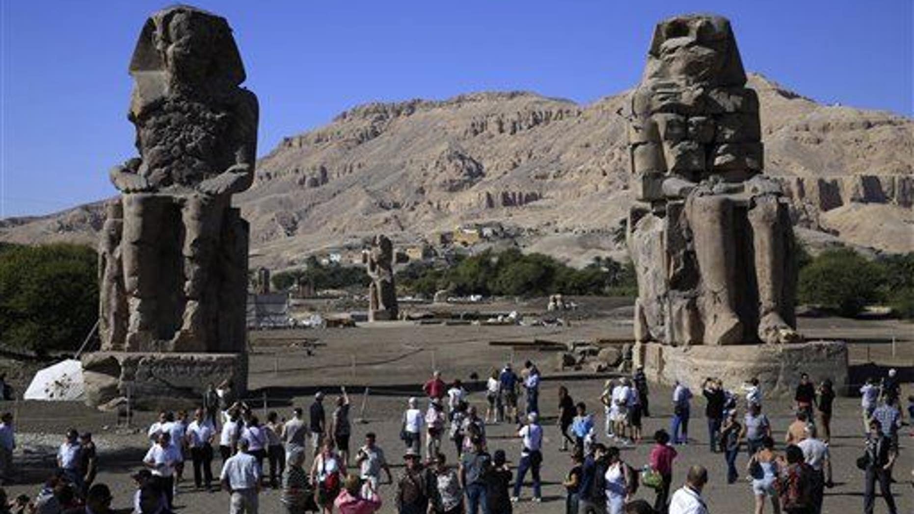 The statue was re-erected the king's funerary temple, which is already known for its Colossi of Memnon, two massive stone statues of Pharaoh Amenhotep III shown here.