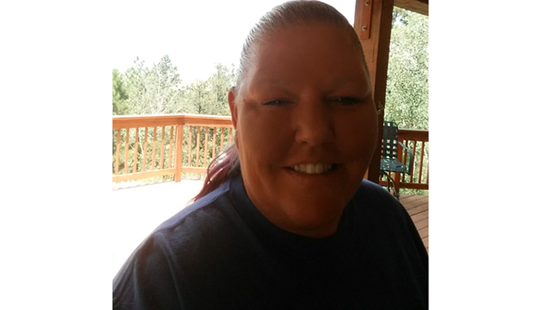 Stayc LaFern, a victim of "caller ID spoofing," is pictured here outside her Colorado Springs two truck business.