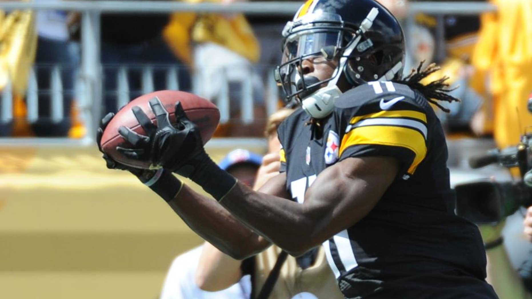FILE - In this Sept. 7, 2014, file photo, Pittsburgh Steelers wide receiver Markus Wheaton (11) catches a pass against the Cleveland Browns in an NFL football game in Pittsburgh. Wheaton spent his rookie season knowing he could make plays but wondering if his body would ever cooperate. Consider the questions answered after the second-year wide receiver set up the winning kick in Pittsburgh's opening victory Cleveland. (AP Photo/Don Wright, File)