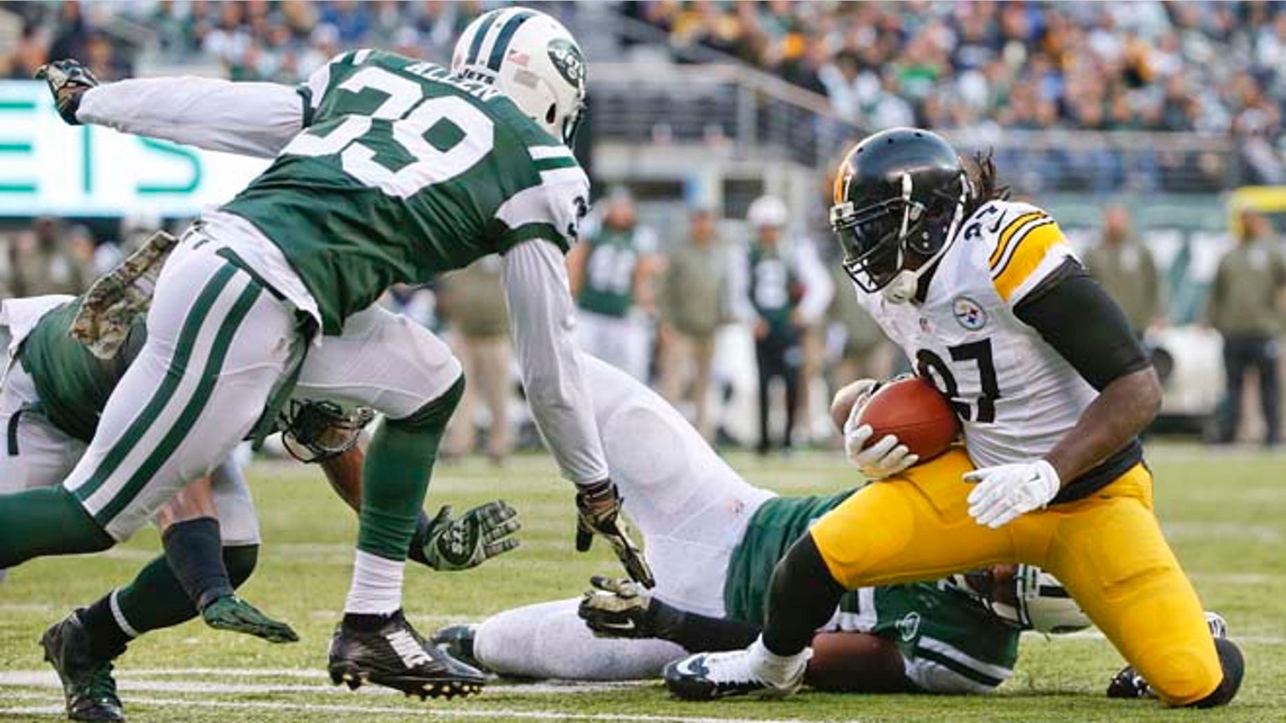 Nov. 9, 2014: Pittsburgh Steelers running back LeGarrette Blount (27) is tackled by New York Jets' Quinton Coples as Jets' Antonio Allen (39) closes in near the goal line during the second half of an NFL football game in East Rutherford, N.J. (AP)