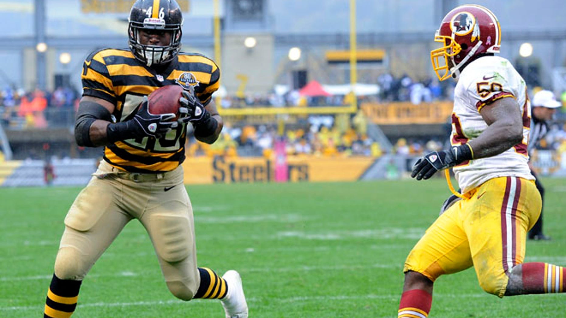 Oct. 28, 2012: Pittsburgh Steelers fullback Will Johnson (46) makes a catch past Washington Redskins inside linebacker London Fletcher (59) for a touchdown in the third quarter of an NFL football game in Pittsburgh.