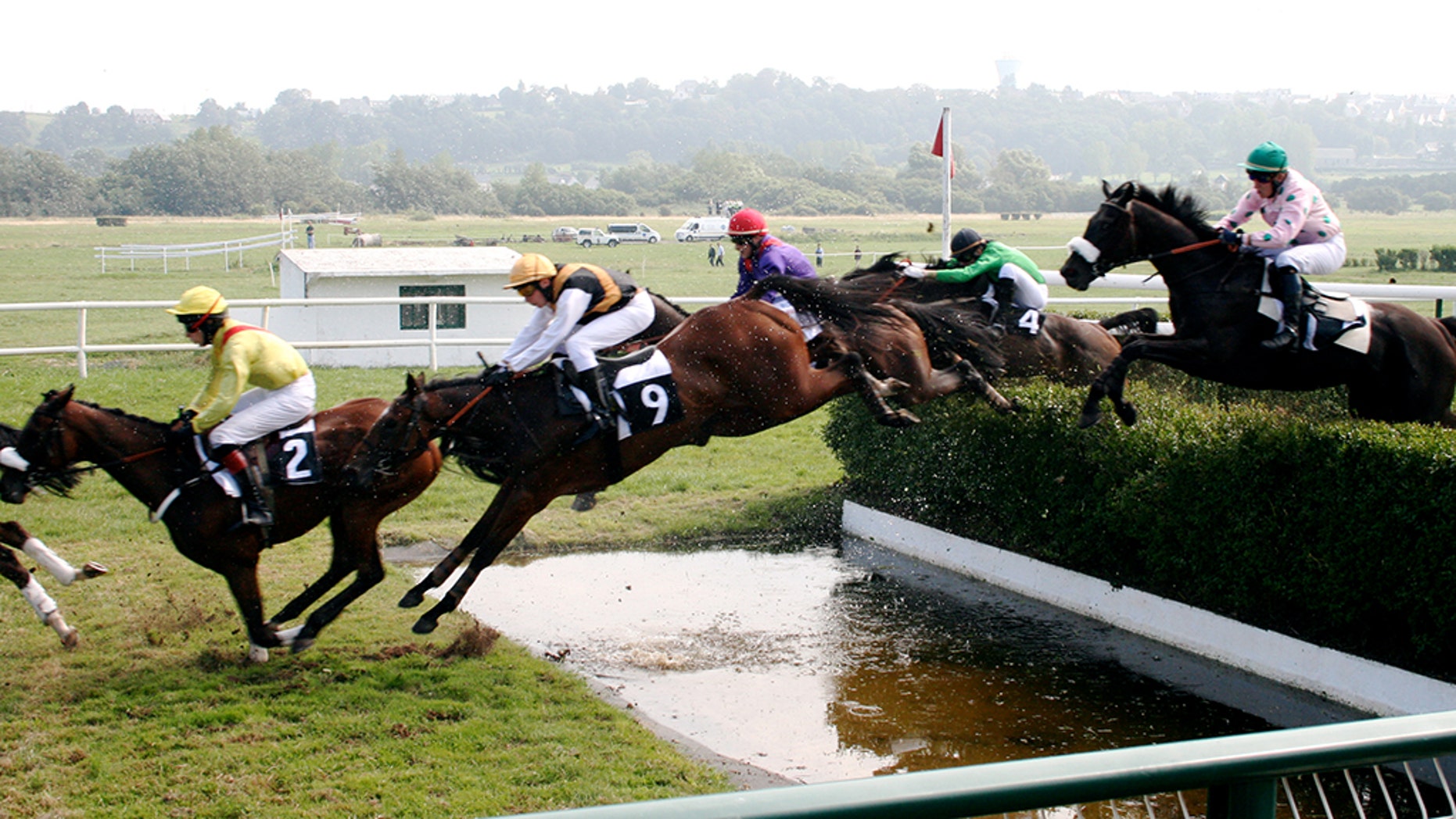 Photo taken during the running of a steeplechase race.