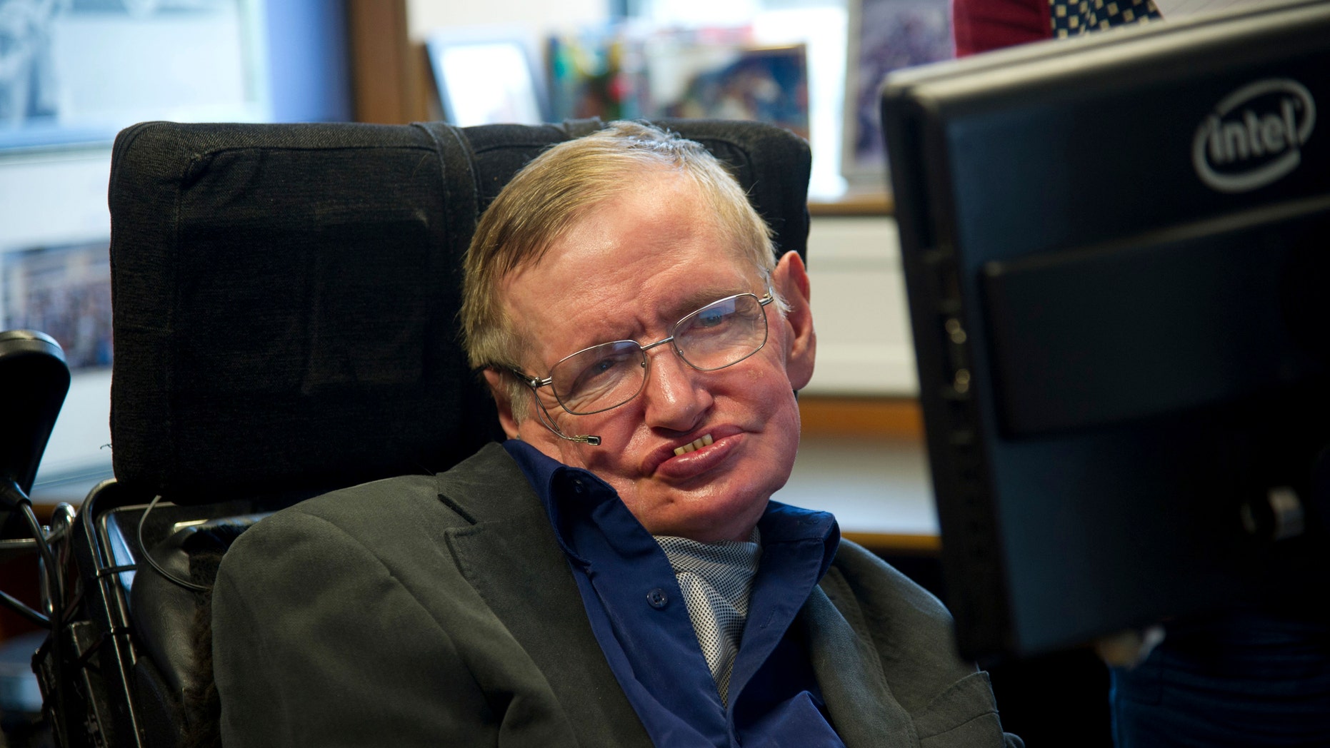 British physicist Stephen Hawking sits at his desk in the Applied Mathematics Department of Cambridge University August 30, 2012. (REUTERS/Guillermo Granja/Vice Presidency of Ecuador/Handout)