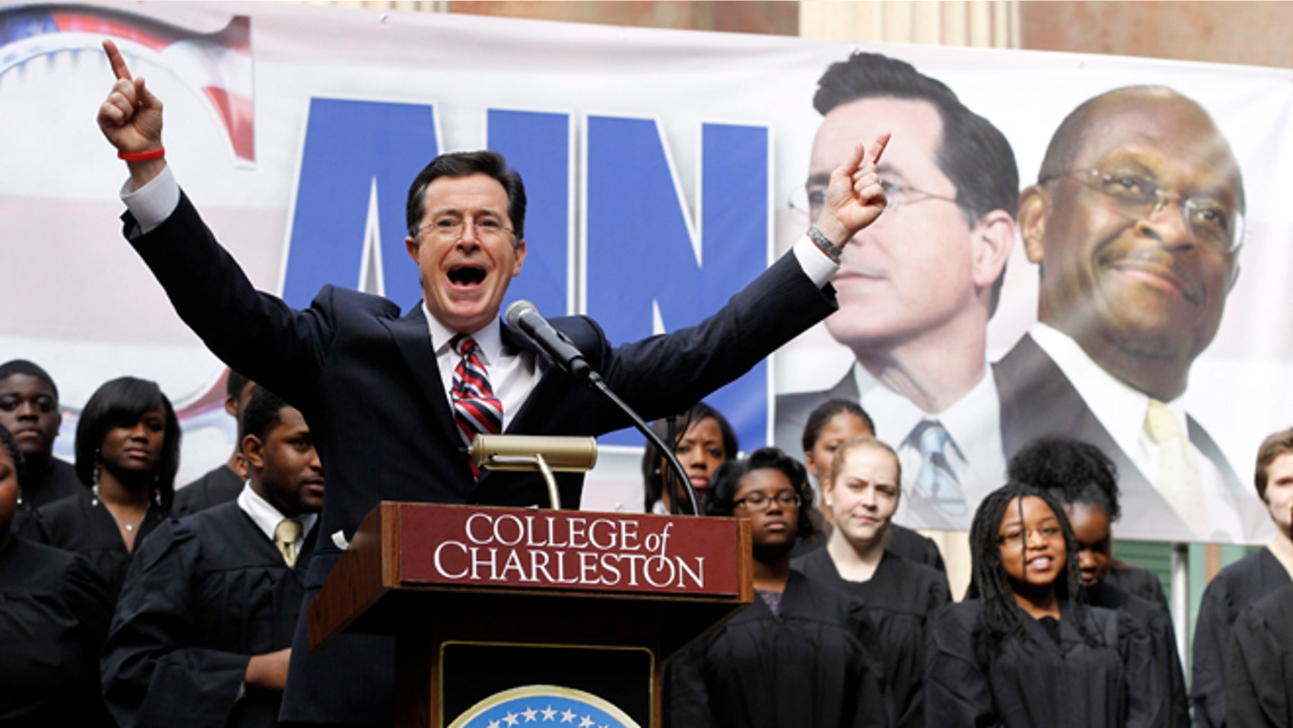 FILE: January 20, 2012: Stephen Colbert hosts a rally with then-GOP presidential candidate Herman Cain, at the College of Charleston, in South Carolina.