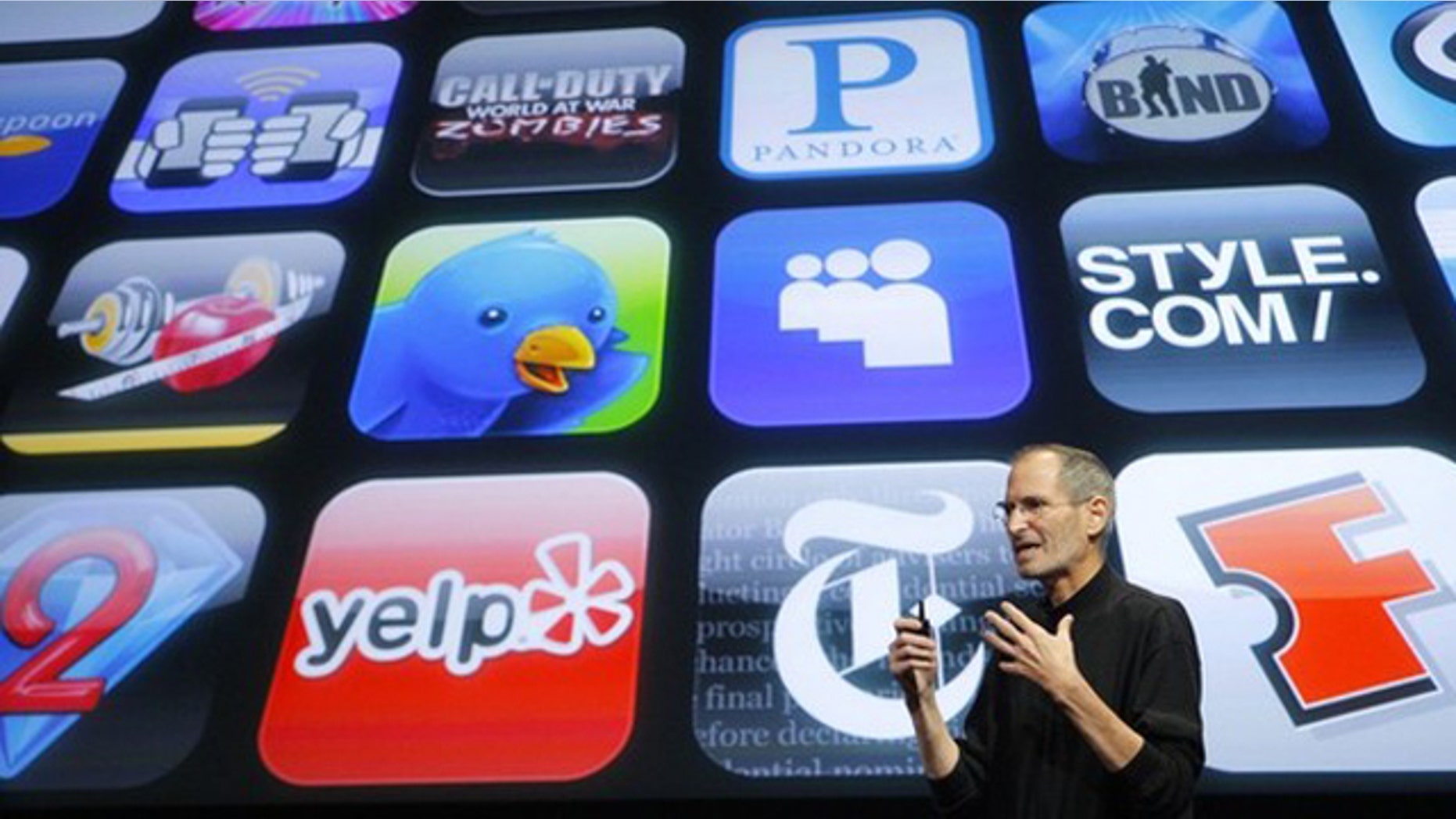 April 8, 2010: Apple Chief Executive Steve Jobs speaks in front of a display showing icons of various apps during the iPhone OS4 special event at Apple headquarters in Cupertino, Calif.