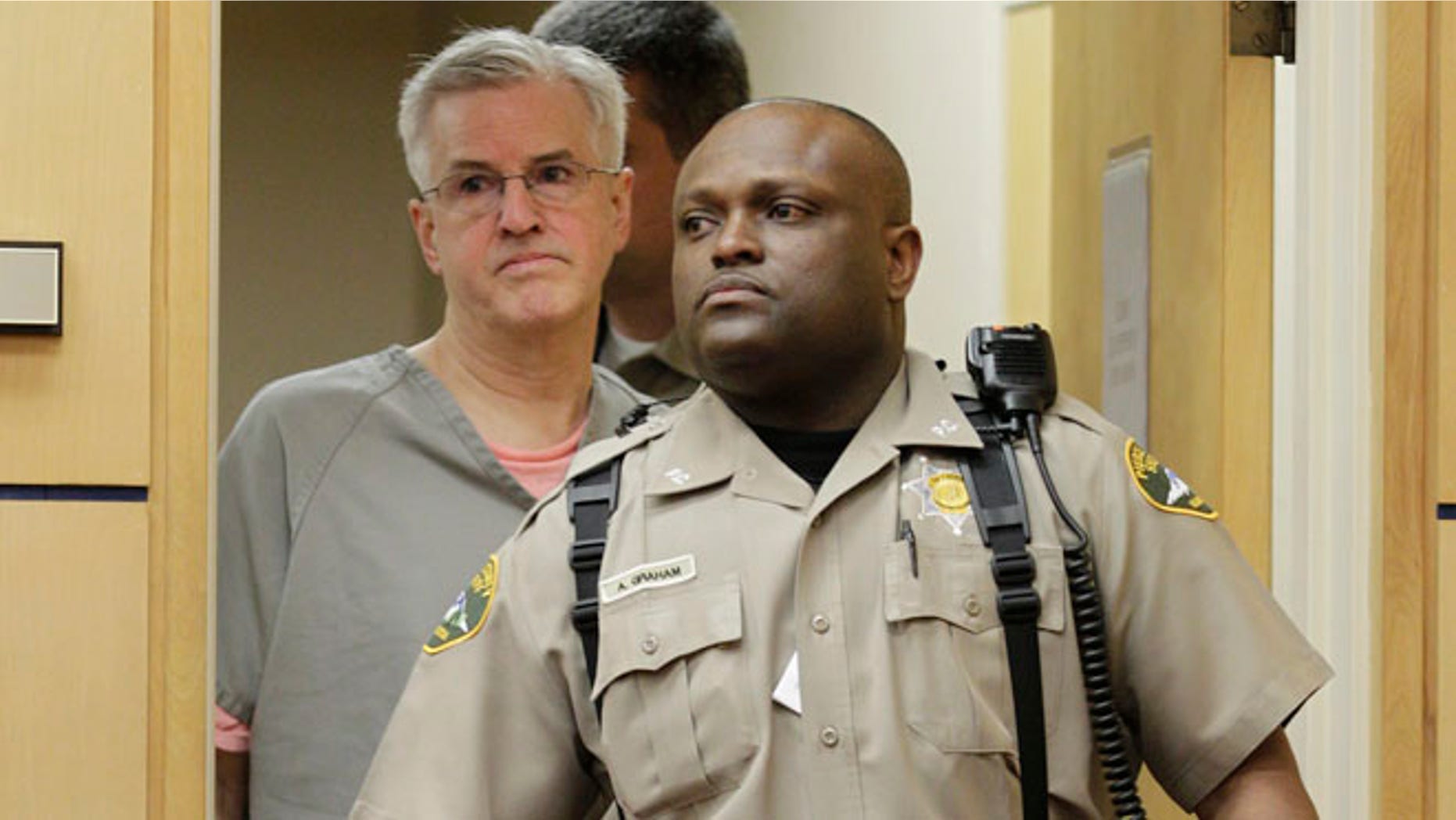 April 23: Steve Powell is led into in a Pierce County Superior Court hearing in Tacoma, Wash.