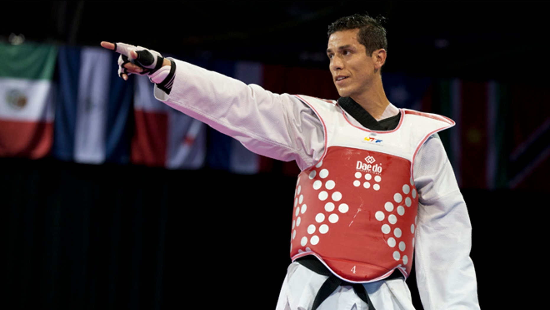 FILE - In this July 21, 2015 file photo, United States' Steven Lopez celebrates winning a bronze medal by defeating Venezuela's Javier Medina in the men's taekwondo under-80kg category at the Pan Am Games in Mississauga, Ontario. Lopez is competing on the Olympic stage for the fifth time, at the Summer Games in Rio de Janeiro, Brazil, where he's looking to add a medal to the ones he claimed in 2000, 2004 and 2008. (AP Photo/Rebecca Blackwell, File)