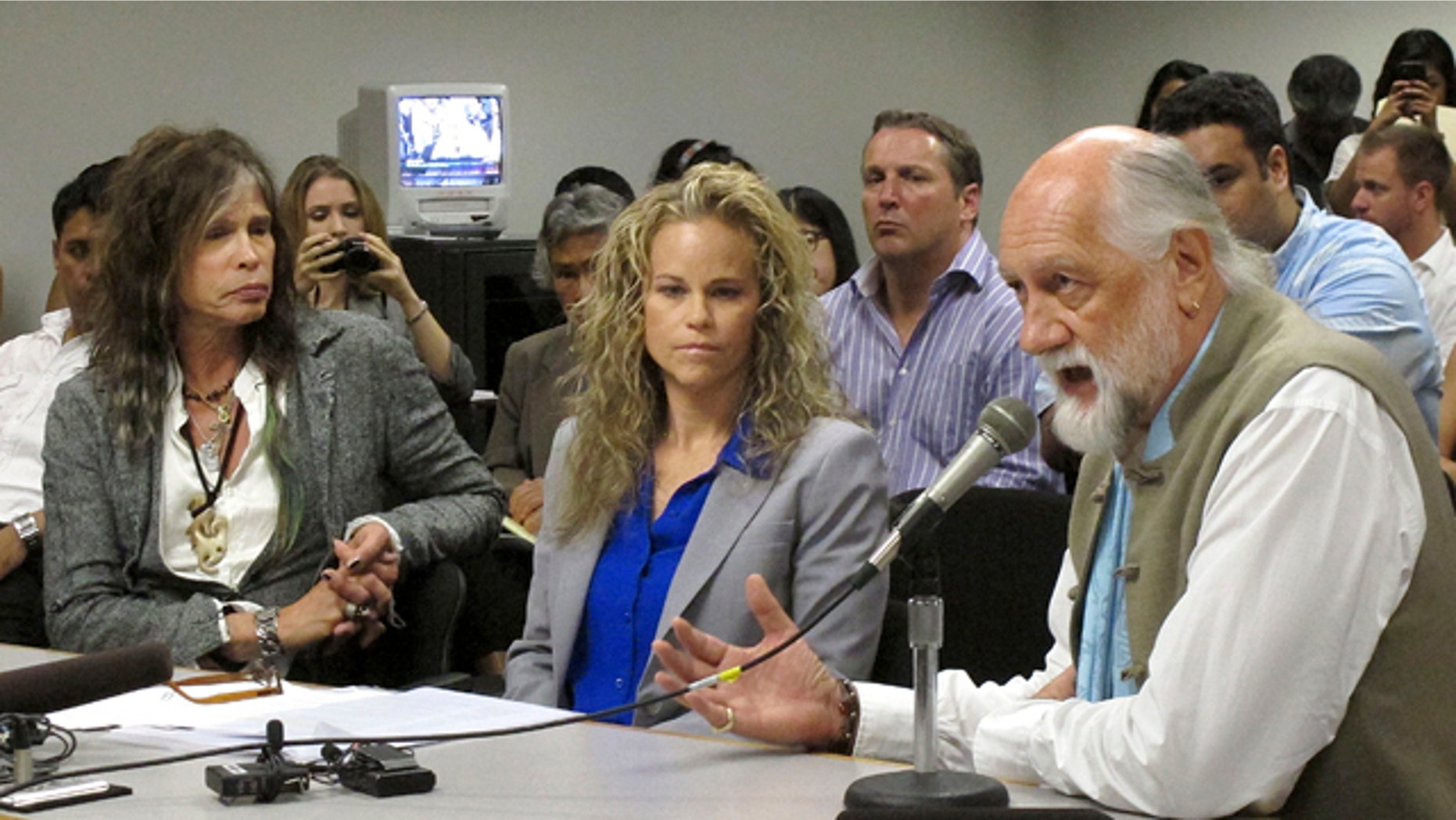 Feb. 8, 2013: Aerosmith lead singer Steven Tyler, left, his attorney Dina LaPolt, center, listen as Fleetwood Mac drummer Mick Fleetwood testifies on celebrity privacy during a hearing at the Hawaii Capitol in Honolulu.