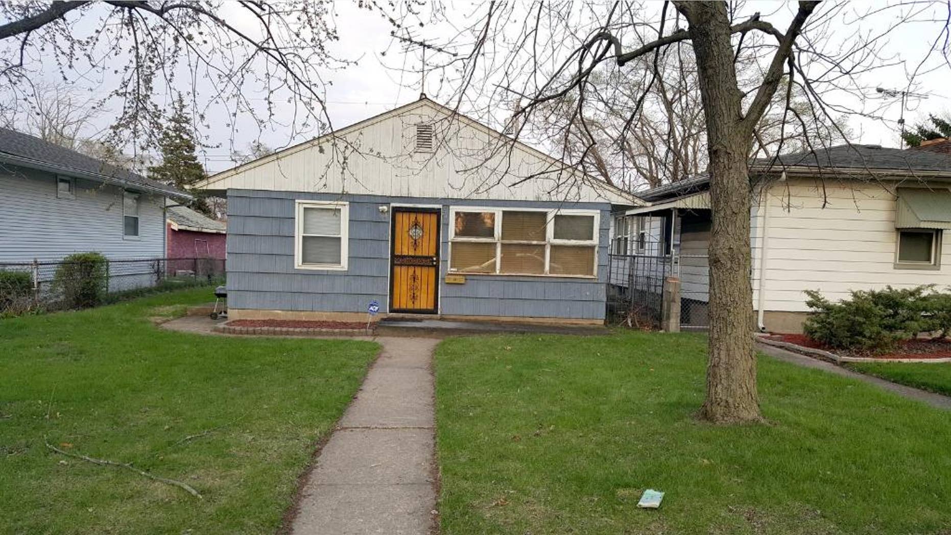 This Tuesday, April 21, 205 photo shows the home where the body of a woman was found by police in Gary, Ind. Madison County prosecutors filed paperwork in Circuit Court on Monday charging Geraldine Jones, 36, of Gary in the death of 23-year-old Samantha Fleming of Anderson. Police investigating Fleming's disappearance on Friday found her body in Jones' home in Gary, about 165 miles northwest of Anderson. When police arrived Fleming's 3-week-old daughter was being held by Jones' sister, who told police she had been caring for her sister's child while her sister was in Texas. Police determined the child was Fleming's and the baby was returned to relatives in Indianapolis. (Michelle L. Quinn/Chicago Tribune via AP) MANDATORY CREDIT CHICAGO TRIBUNE; CHICAGO SUN-TIMES OUT; DAILY HERALD OUT; NORTHWEST HERALD OUT; THE HERALD-NEWS OUT; DAILY CHRONICLE OUT; THE TIMES OF NORTHWEST INDIANA OUT; TV OUT; MAGS OUT; NO SALES