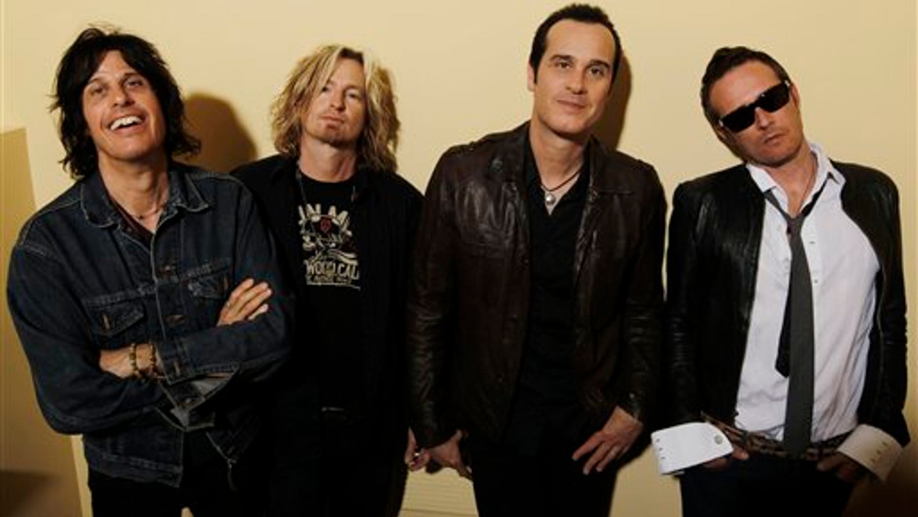 This April 30, 2010 file photo shows the Stone Temple Pilots, from left, Dean Deleo, Eric Kretz, Robert Deleo, and Scott Weiland from the band Stone Temple Pilots, pose for a portrait in Santa Monica, Calif.