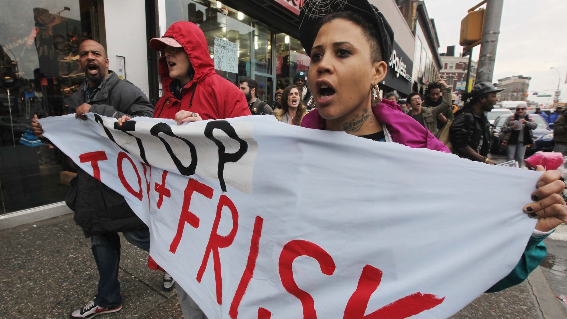 Opponents of the New York Police Department's controversial "stop-and-frisk" policy march.