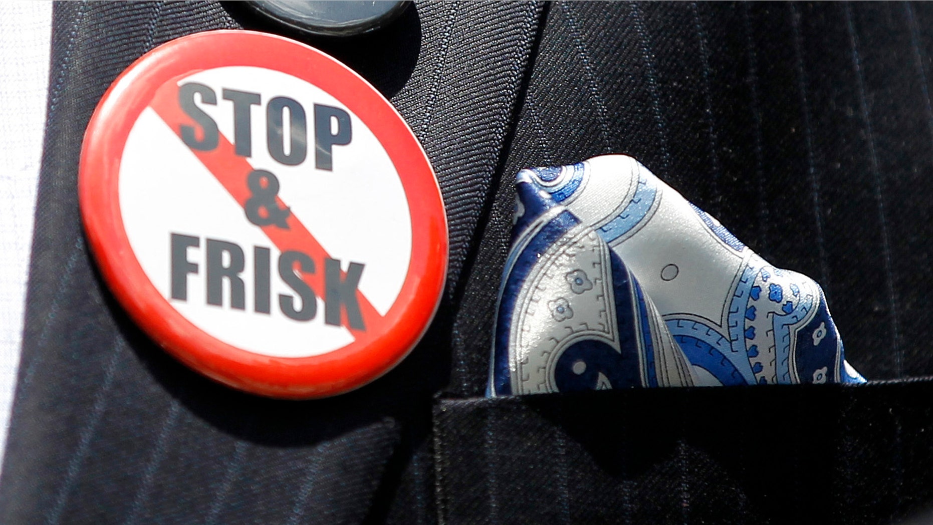 New York City Councilman Jumaane Williams displays several button as he speaks about the New York Police Department's stop and frisk policy, Thursday, June 7, 2012, during a news conference on Capitol Hill in Washington. (AP Photo/Haraz N. Ghanbari)