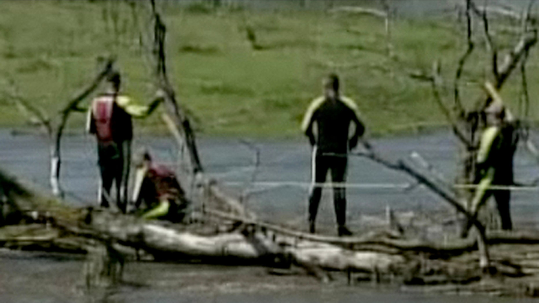Aug. 11: Rescue workers search for the body of a missing woman who was in one of three cars swept off the road by flood waters in Des Moines, Iowa.