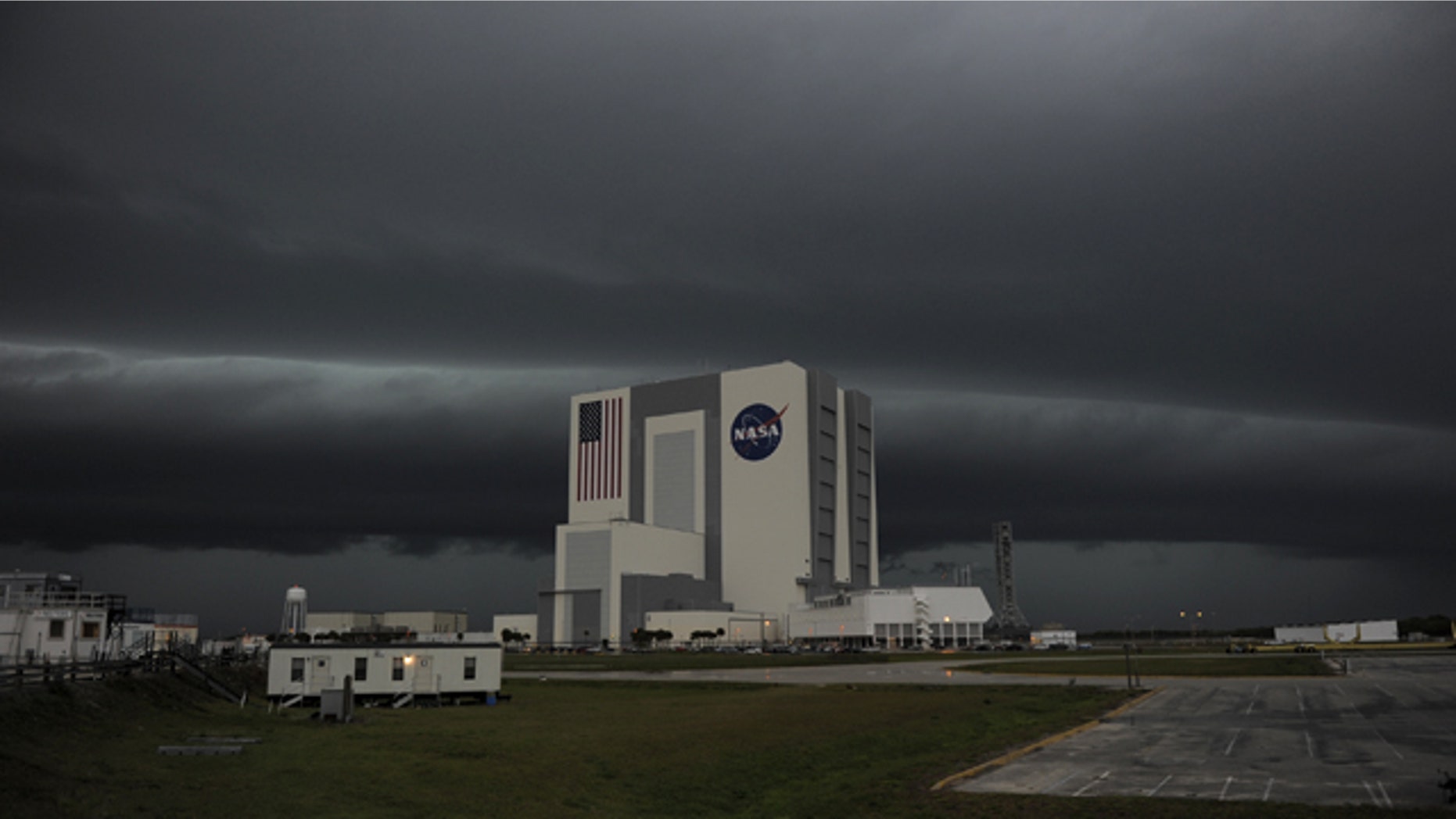 Severe storms darken the skies over Kennedy Space Center in Florida Thursday, causing delays in space shuttle Endeavours STS-134 mission launch dress rehearsal.
