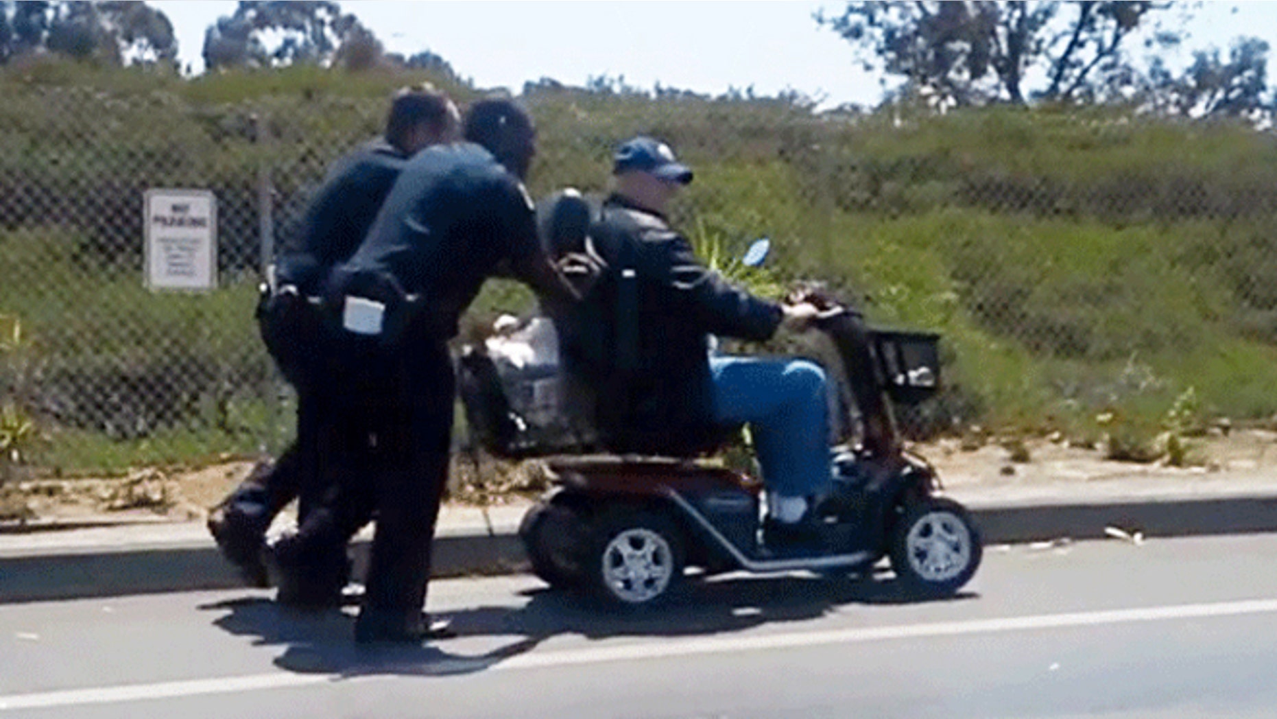 Video shows officers pushing disabled veteran after his scooter lost power.