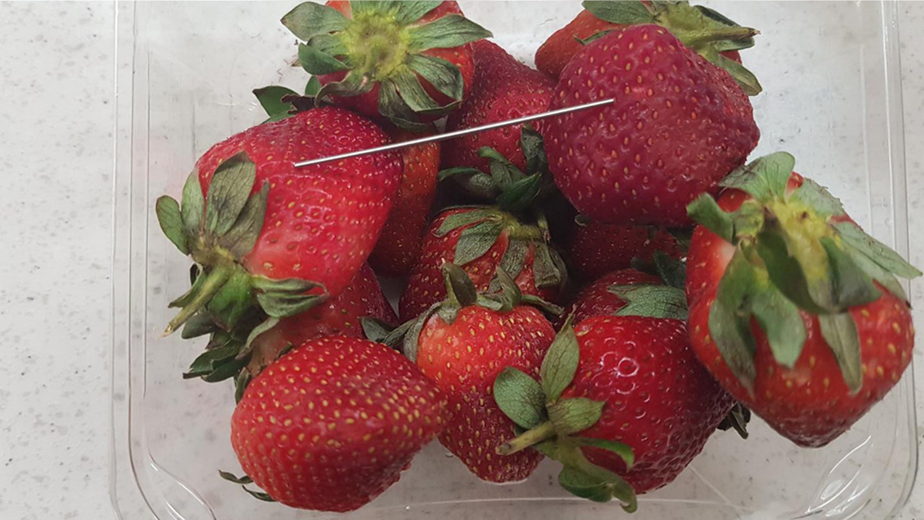 Queensland police in Australia issued a photo of a batch of "contaminated strawberries" in connection to what they said they believe is a "copycat incident."