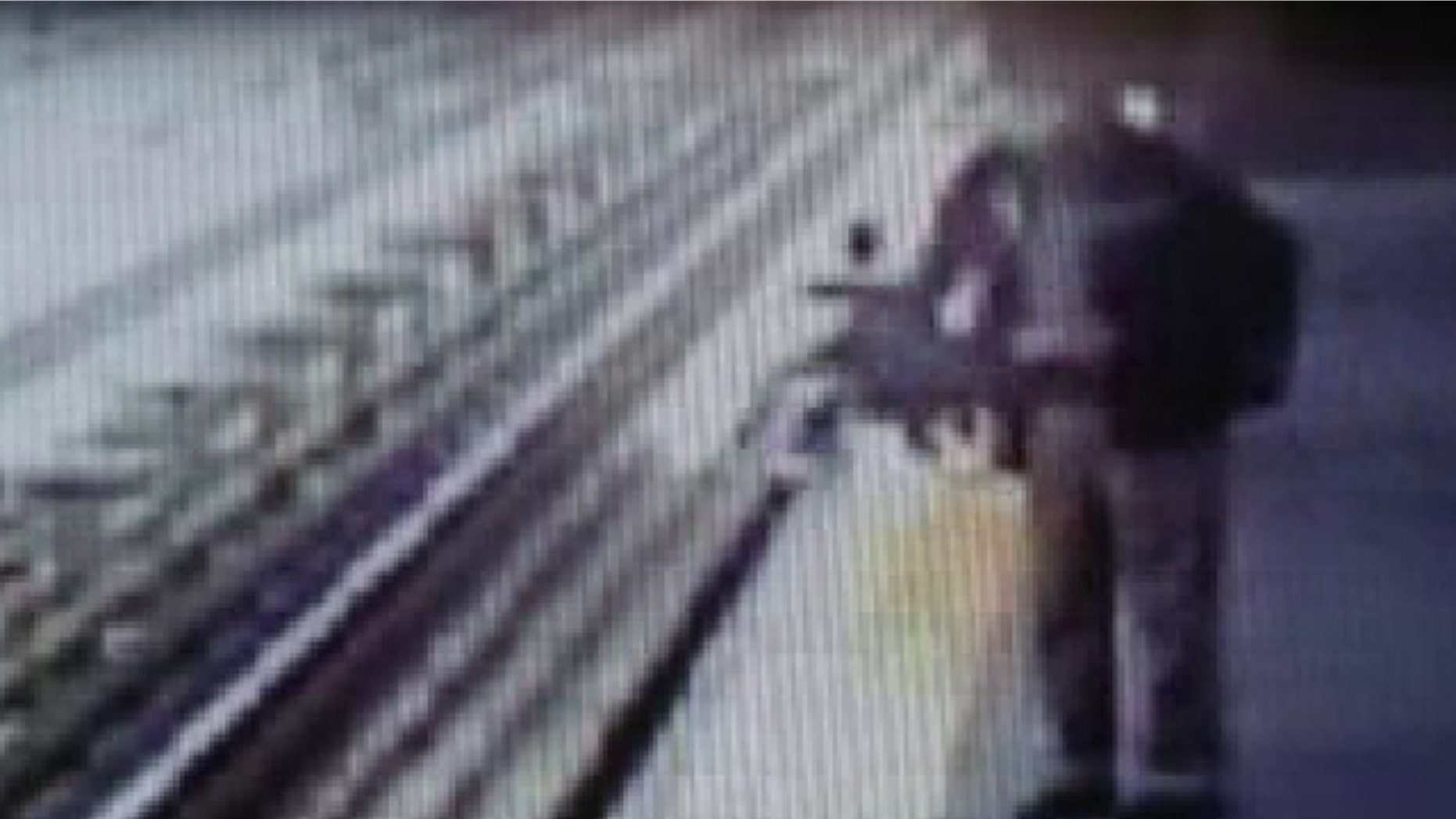 May 16, 2013: A baby's stroller falls into the train tracks in Philly in this video still.