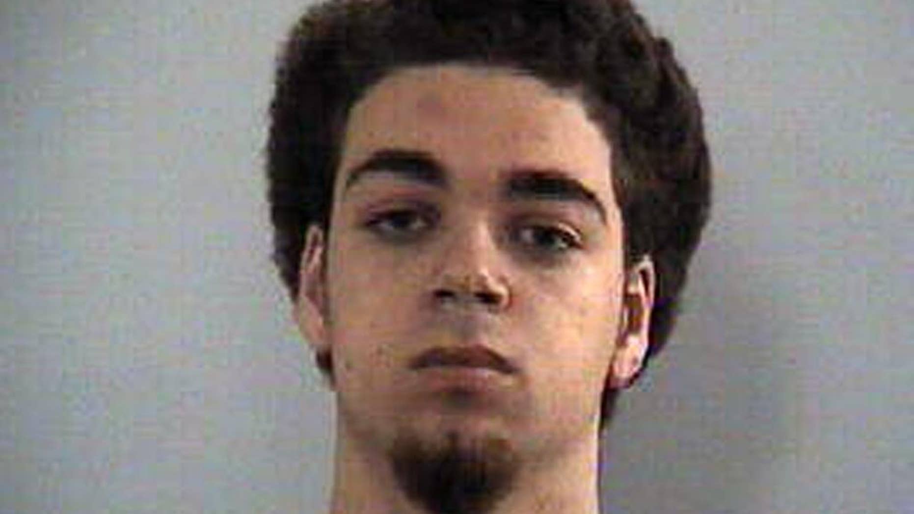 This undated photo provided by the Lexington-Fayette County government shows Justin Smith. Smith and Efrain Diaz were arrested Friday, April 17, 2015, and charged with murder and robbery. Jonathan W. Krueger was shot and killed a block from the Lexington campus Friday morning in what police believe was a random robbery gone awry. (Lexington-Fayette County government via AP)