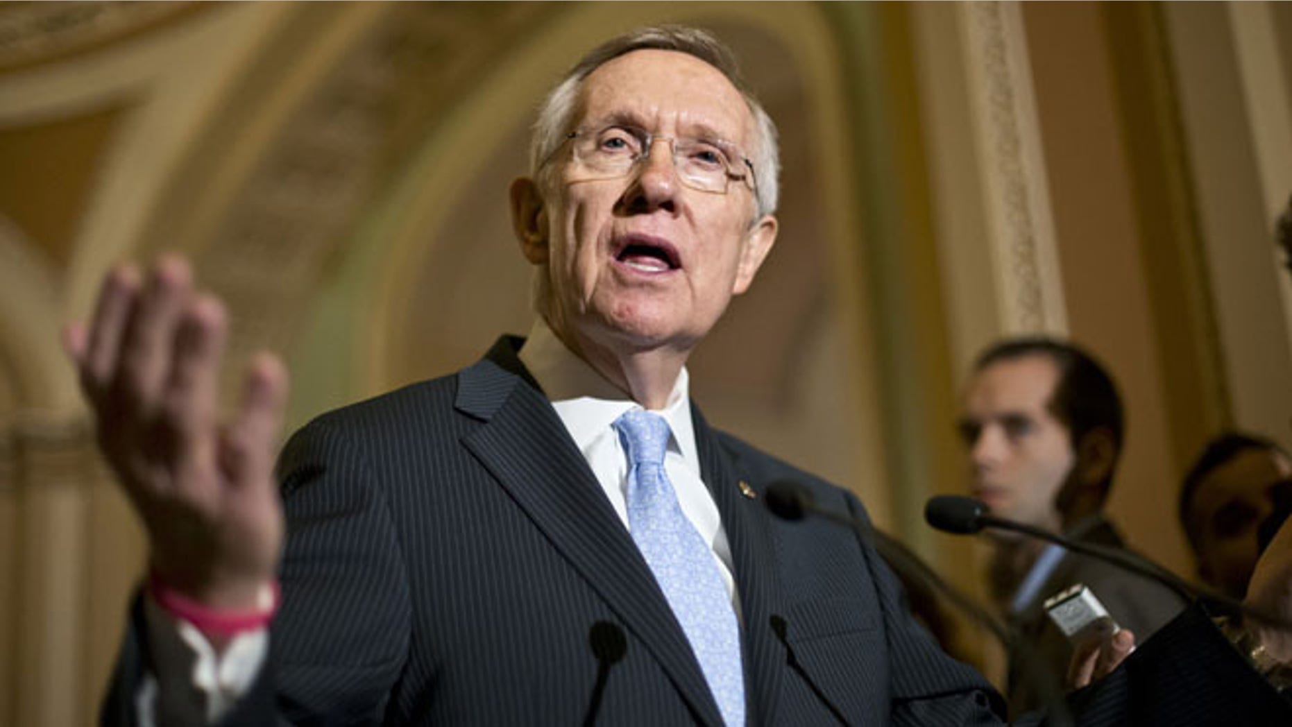 July 9, 2013: Senate Majority Leader Harry Reid of Nev. gestures as he speaks with reporters on Capitol in Washington about student loan rates following a Democratic strategy session. Reid scheduled a procedural vote for Wednesday on a bill restoring the interest rate on subsidized Stafford loans to 3.4 percent for one year. Interest rates doubled to 6.8 percent last week because Congress didn't avert a rate hike built into the law.