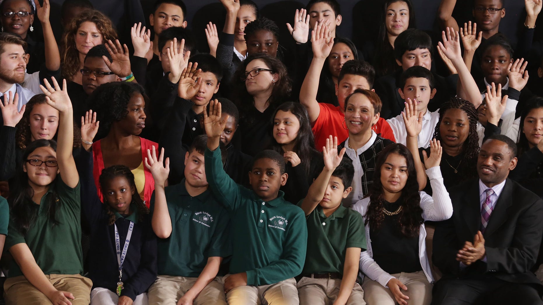 Students in Adelphi, Maryland, raise their hands when asked if they planned on going to college
