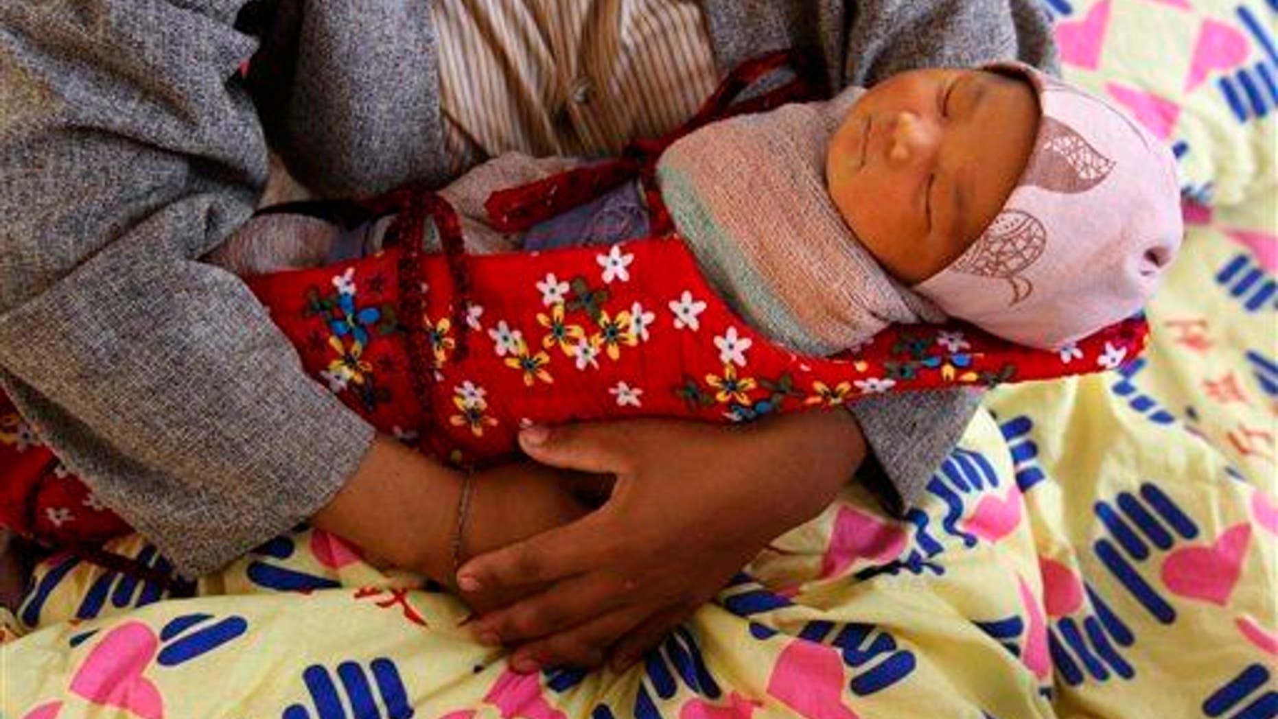 Four-day-old infant is shown.