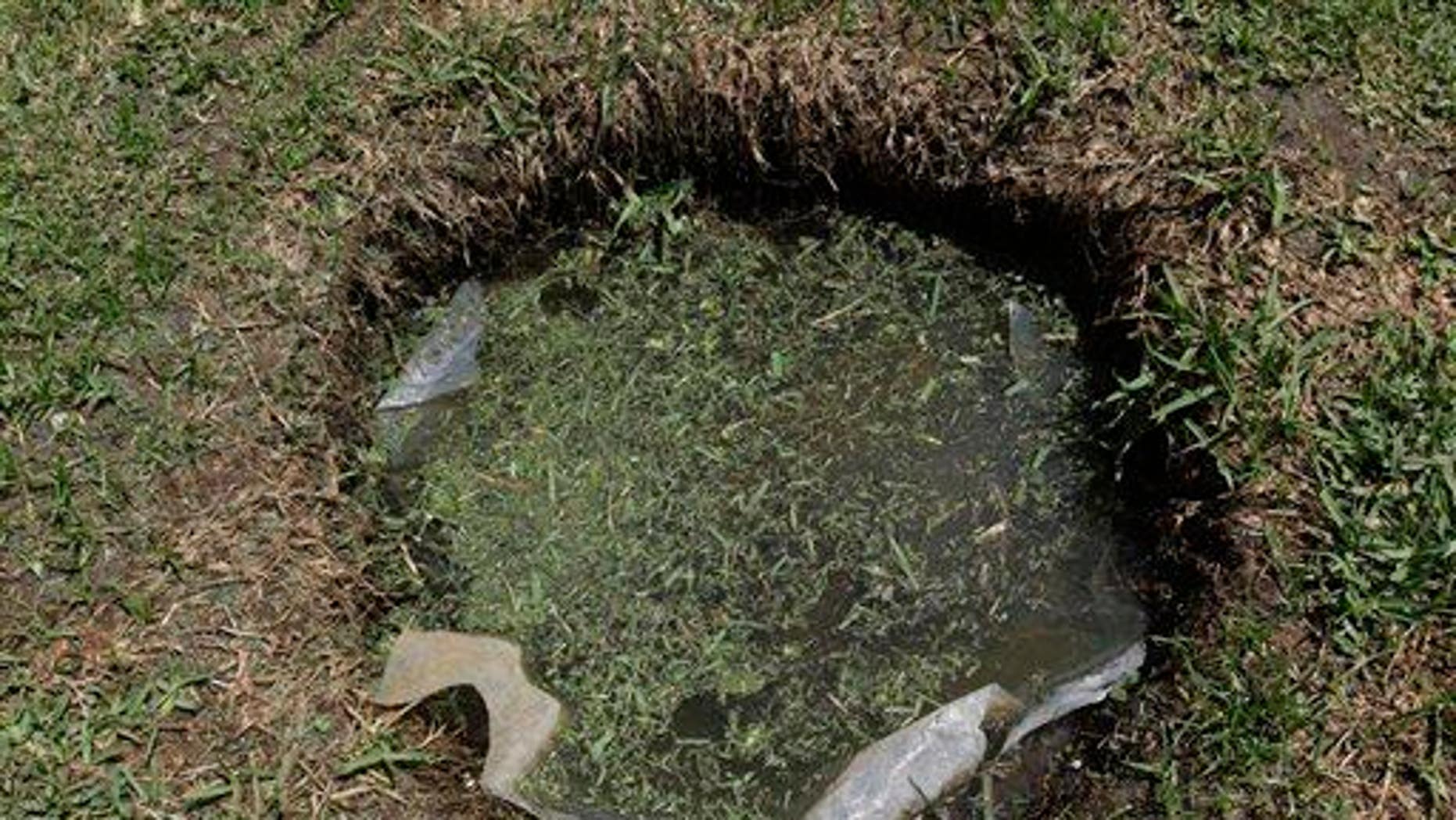 septic tank overflowing with water