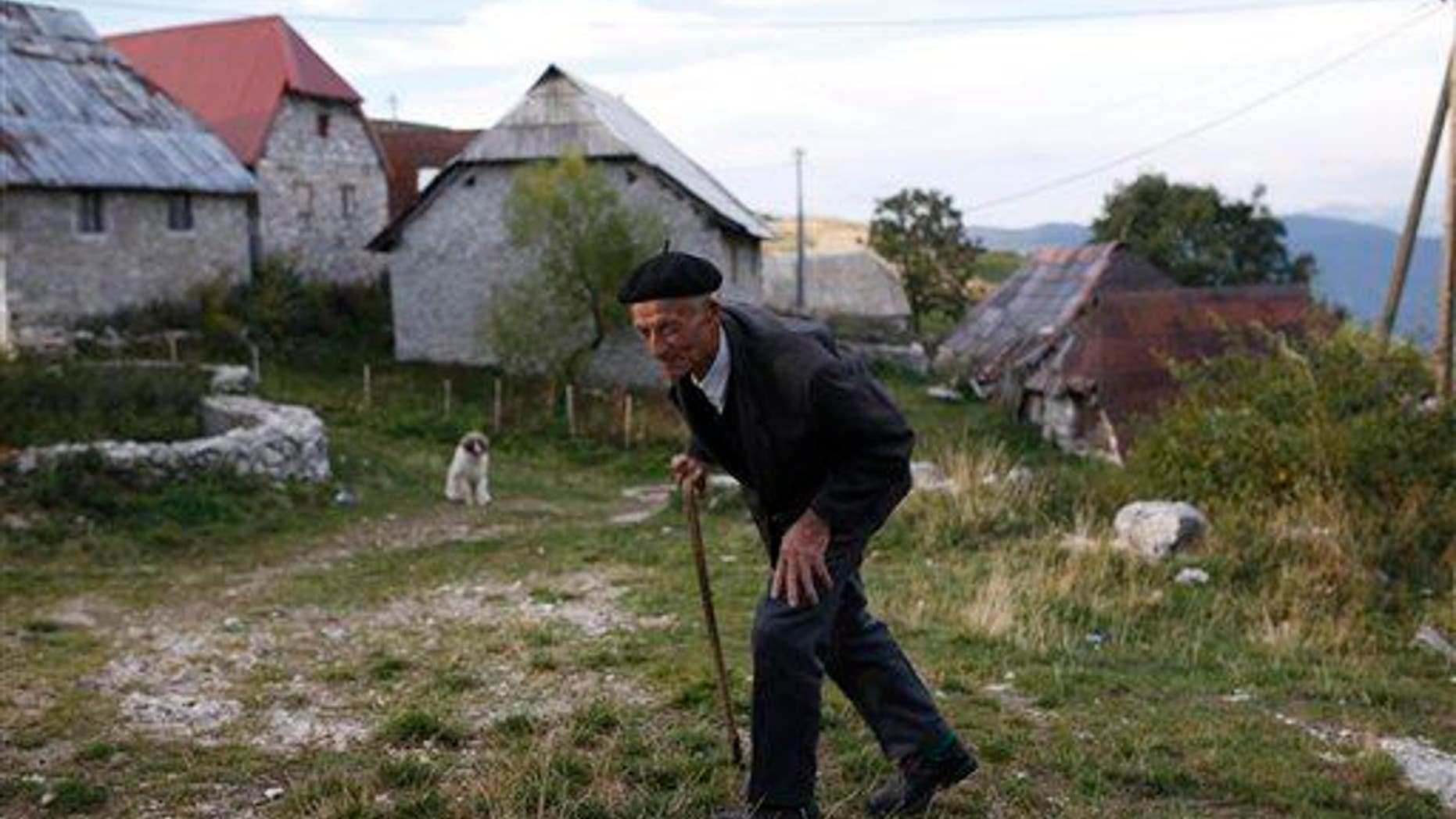 An elderly man walks in the remote mountain village of Lukomir, south of Sarajevo, Bosnia, on Sept. 24, 2015.