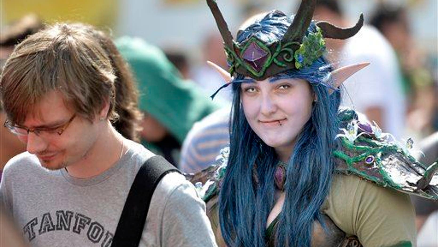 A girl in a fantasy dress arrives at gaming fair in Cologne, Germany, in this file photo.