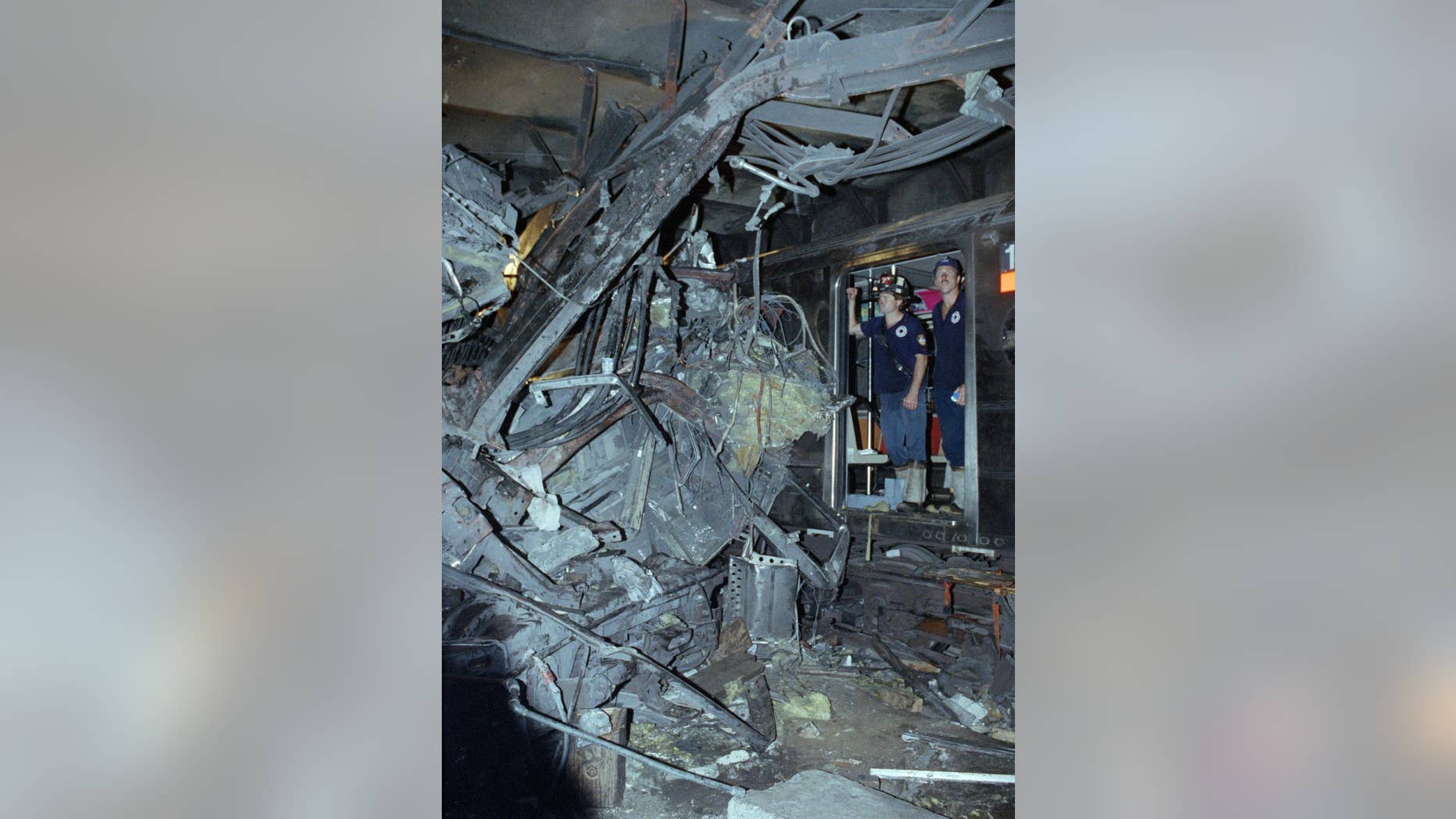 FILE - In this Aug. 28, 1991, file photo, firemen look at the twisted remains of a downtown Lexington Avenue 4 subway train after its derailment at Union Square in New York. Far removed from an era when New Yorkers knew him as the drunken motorman in a nightmarish subway crash, Robert Ray once again found himself in a miserable situation. This time, Ray was the victim, mowed down by a hit-and-run driver as he tried to cross a busy thoroughfare in the Bronx on May 28, 2015. (AP Photo/File)
