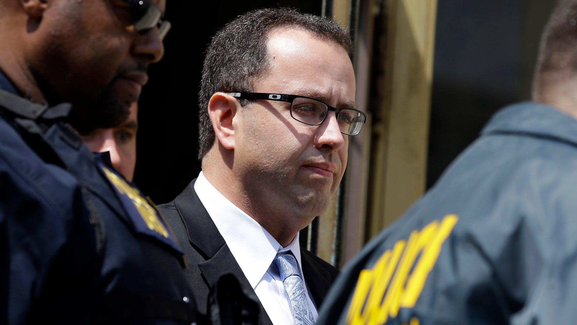 Aug. 19, 2015- FILE photo of former Subway restaurant spokesman Jared Fogle leaving the Federal Courthouse in Indianapolis following a hearing on child-pornography charges. 10 Fogle victims have received the $100,000 in restitution he was ordered to pay each of them.